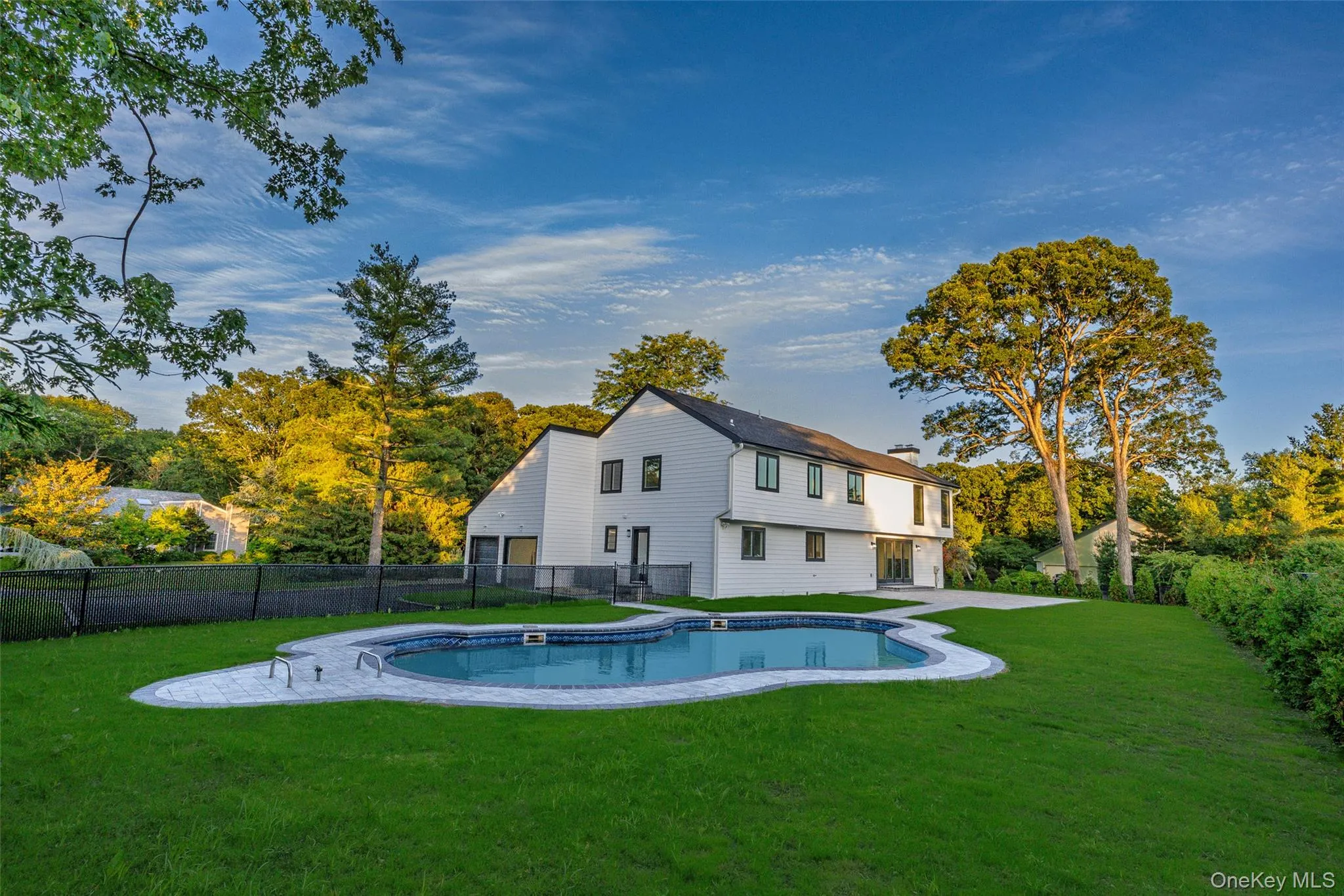 Lush green backyard with private pool. Lush green backyard with private pool.