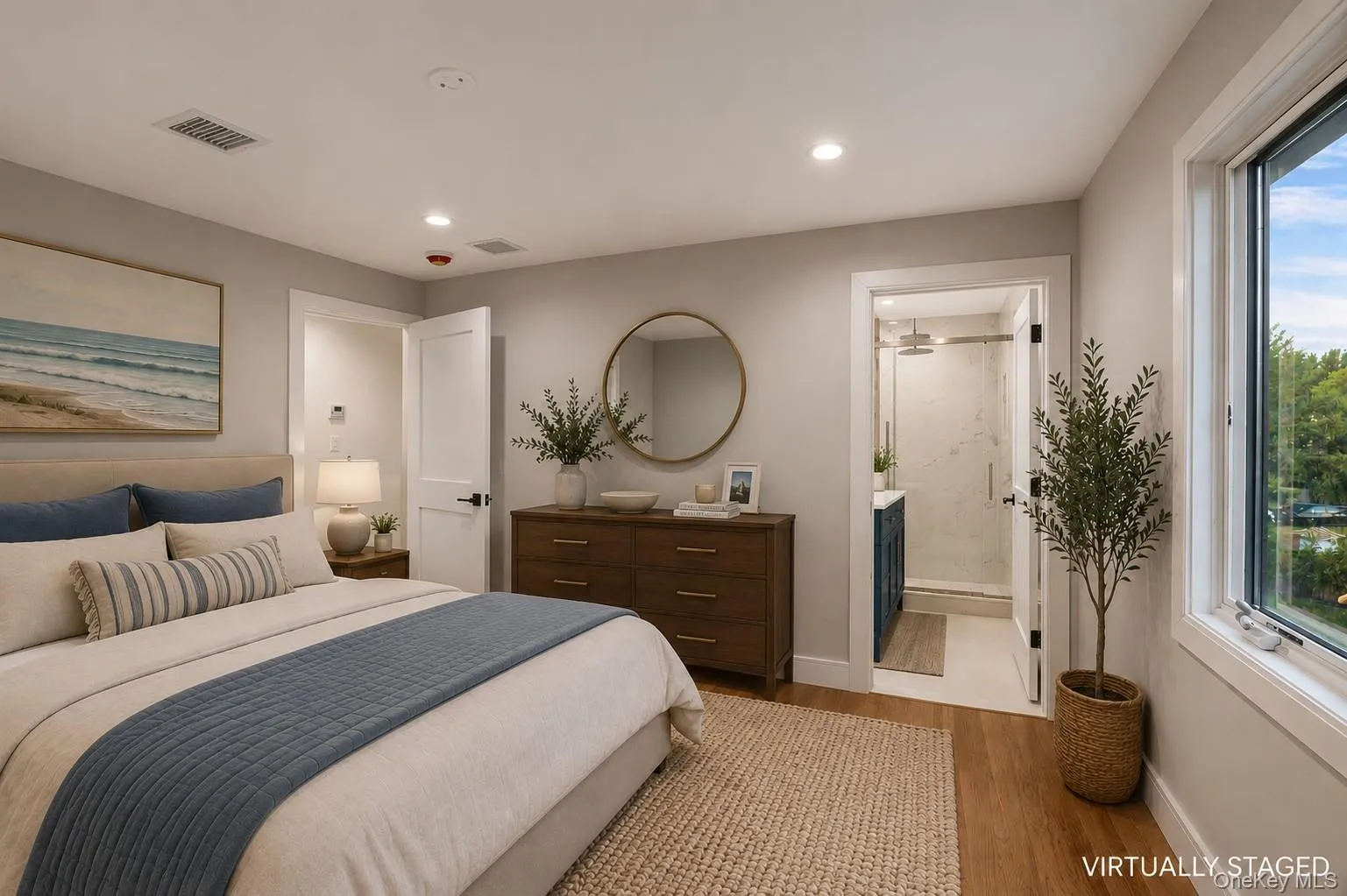 Spacious bedroom featuring wood flooring, neutral wall tones, recessed lighting, and a window providing natural light. Virtually Staged. Spacious bedroom featuring wood flooring, neutral wall tones, recessed lighting, and a window providing natural light. Virtually Staged.
