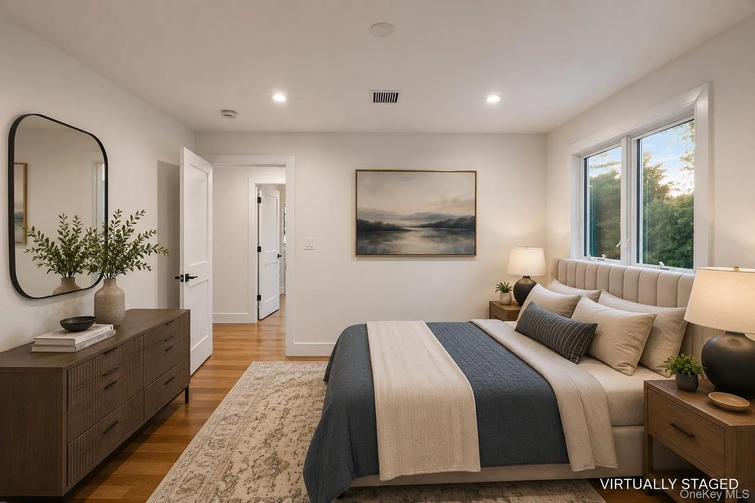 Bedroom featuring wood-finish flooring, recessed lighting, and white trim. Virtually Staged Bedroom featuring wood-finish flooring, recessed lighting, and white trim. Virtually Staged