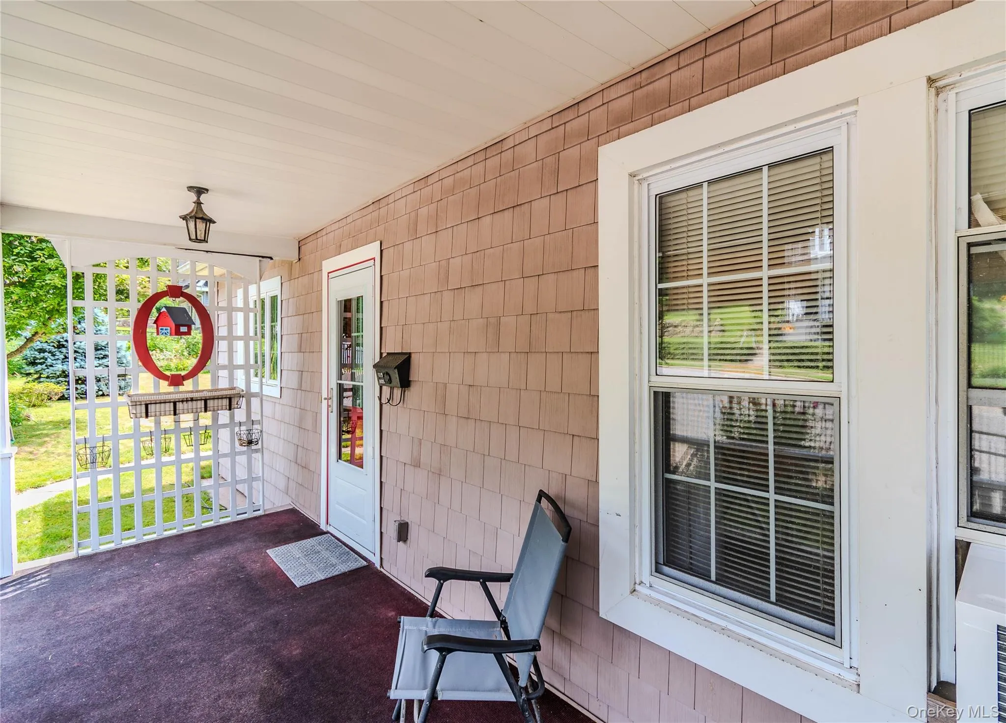 Covered porch entry featuring shake siding Covered porch entry featuring shake siding