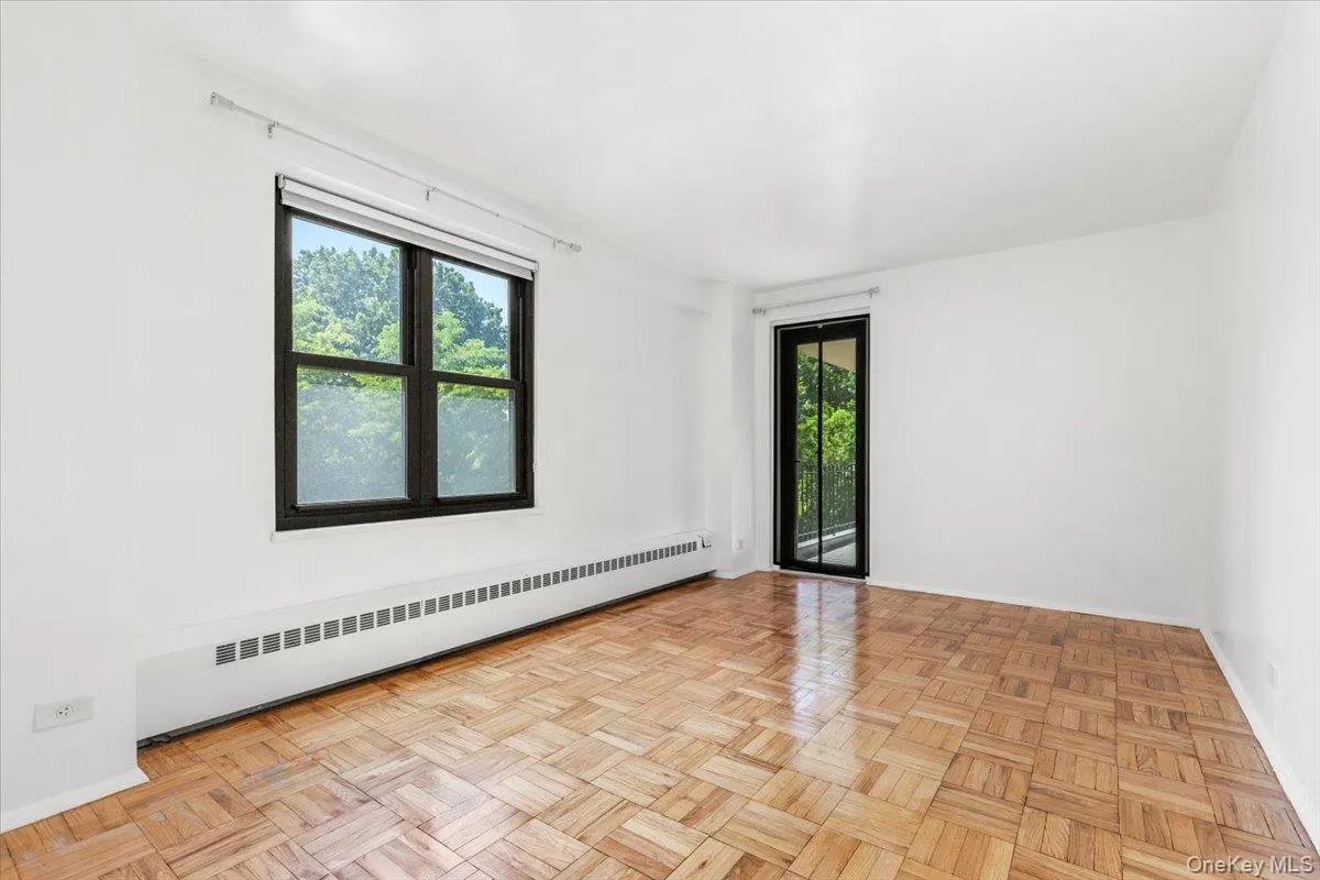 Bedroom with double windows and access to the balcony Bedroom with double windows and access to the balcony