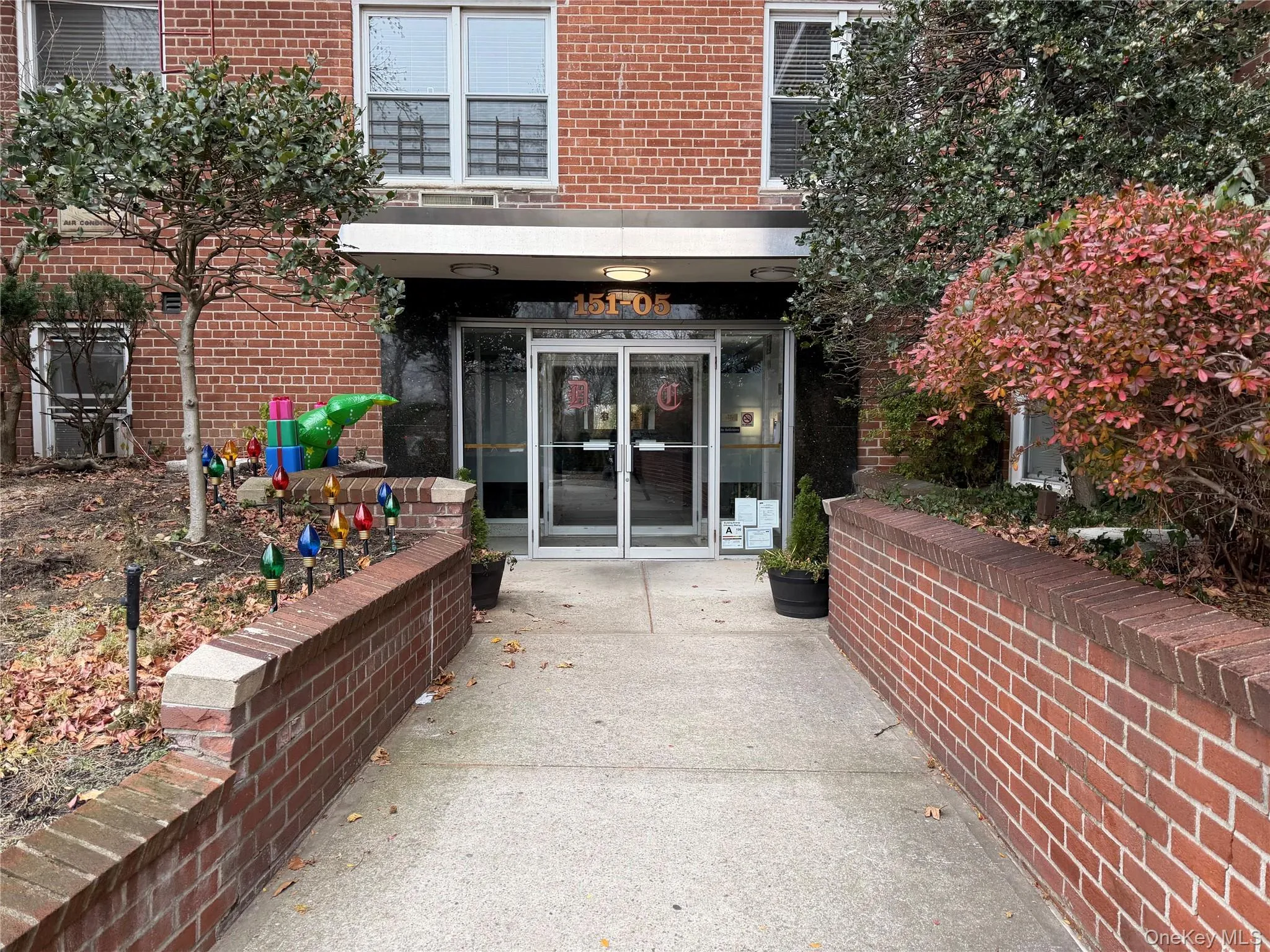 Property entrance with brick siding and french doors Property entrance with brick siding and french doors