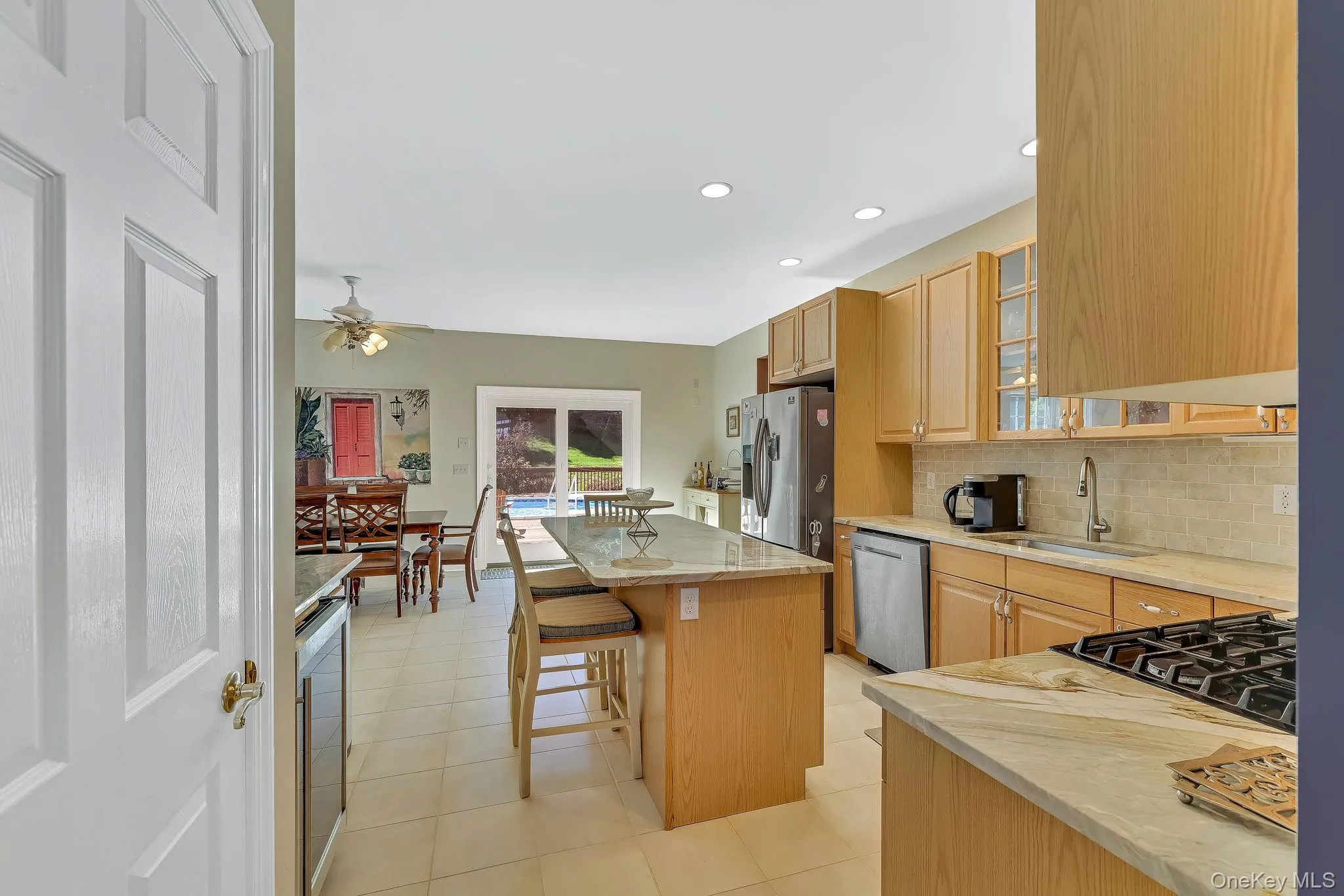 Open concept flow, granite counters, tumbled marble back splash and stainless steel appliances Open concept flow, granite counters, tumbled marble back splash and stainless steel appliances