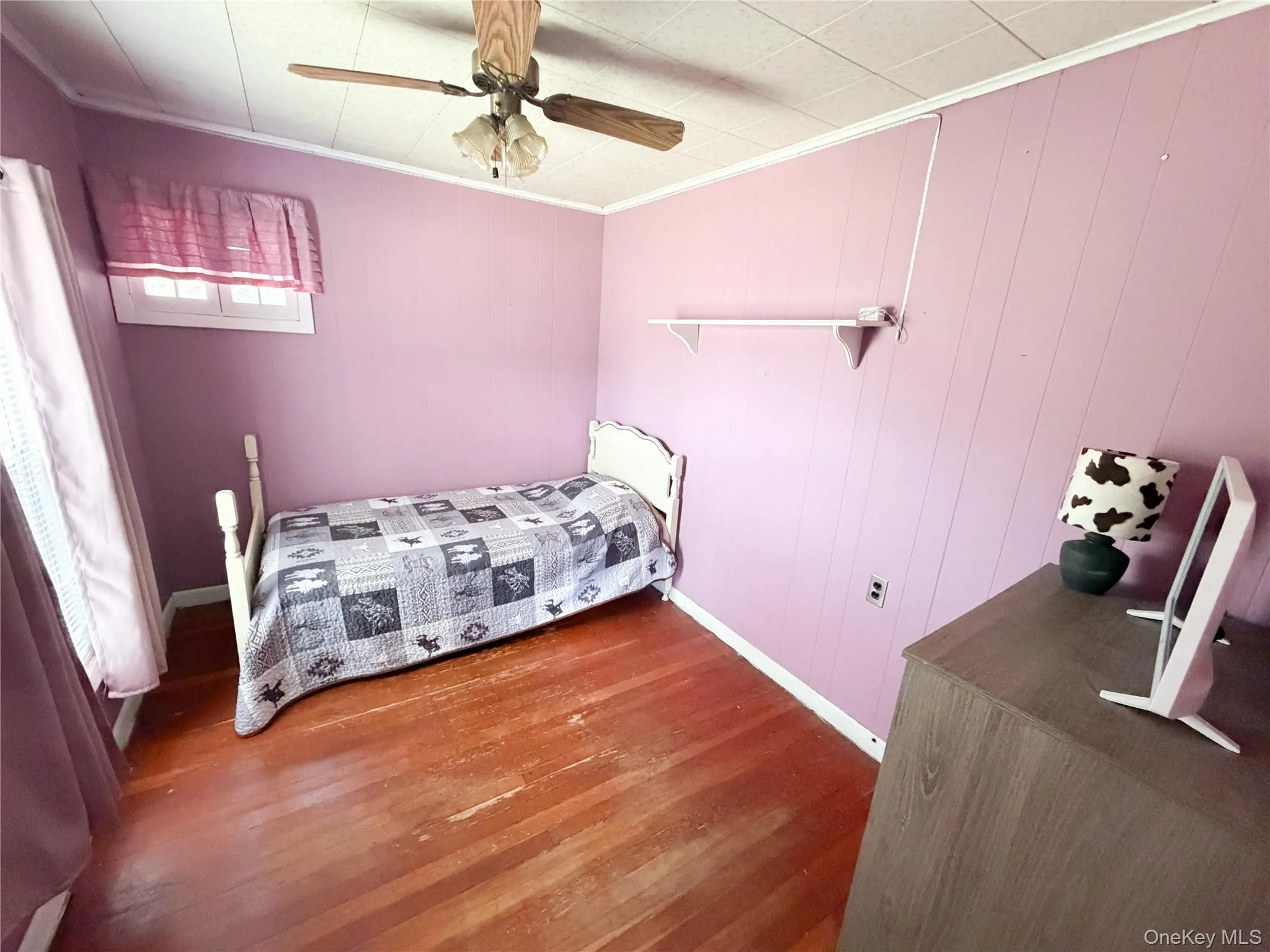 Hardwood flooring and paneled walls create a distinct aesthetic Hardwood flooring and paneled walls create a distinct aesthetic