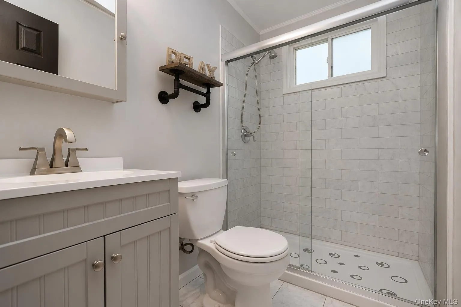 Full bath with walk in shower with a window Full bath with walk in shower with a window