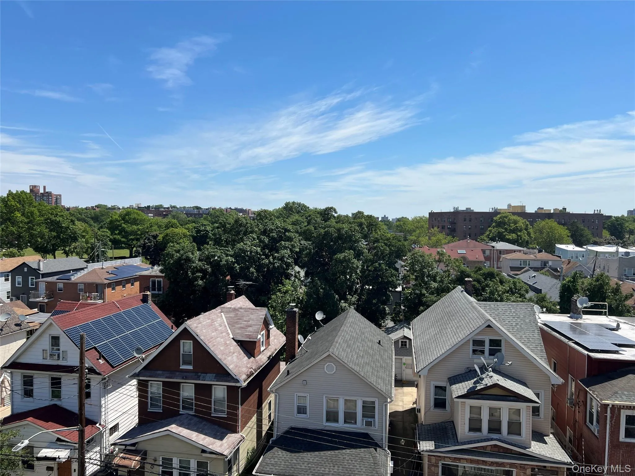 Residential rooflines with varying architectural styles, including gables and dormers Residential rooflines with varying architectural styles, including gables and dormers