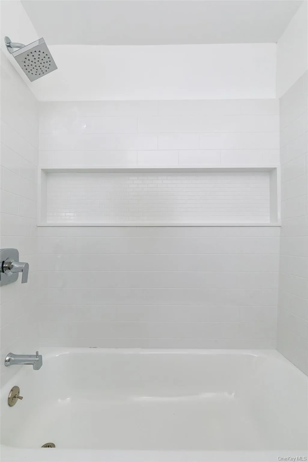 Bathroom with tiled shower / bath combo Bathroom with tiled shower / bath combo