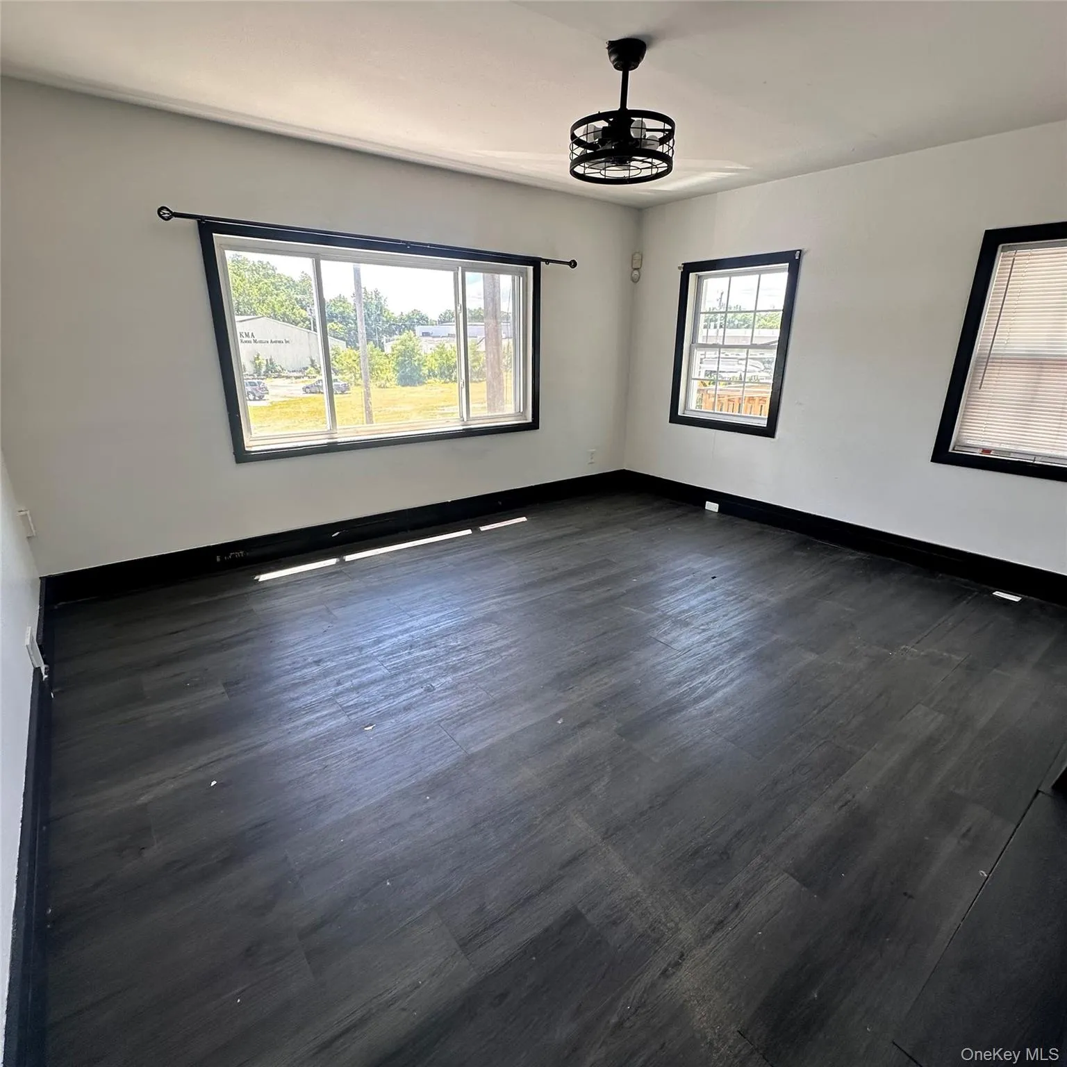Living room. Vinyl flooring, ceiling fan with light, forced air vent. Living room. Vinyl flooring, ceiling fan with light, forced air vent.