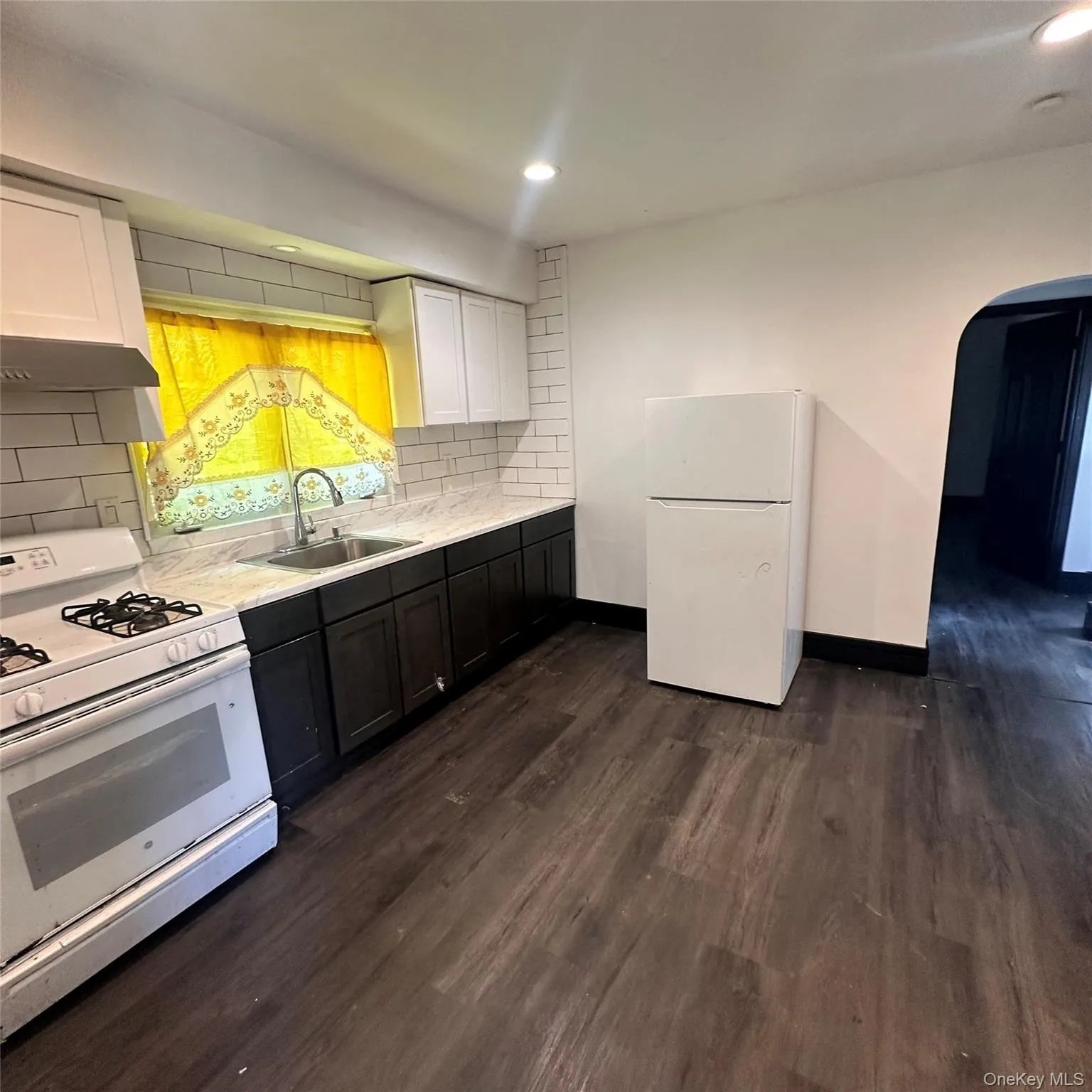 Vinyl flooring, recess lighting, gas range, exhaust fan, refrigerator. Vinyl flooring, recess lighting, gas range, exhaust fan, refrigerator.