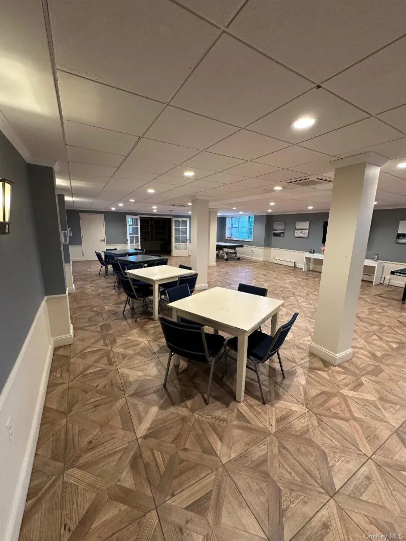 Dining space with a drop ceiling and recessed lighting Dining space with a drop ceiling and recessed lighting