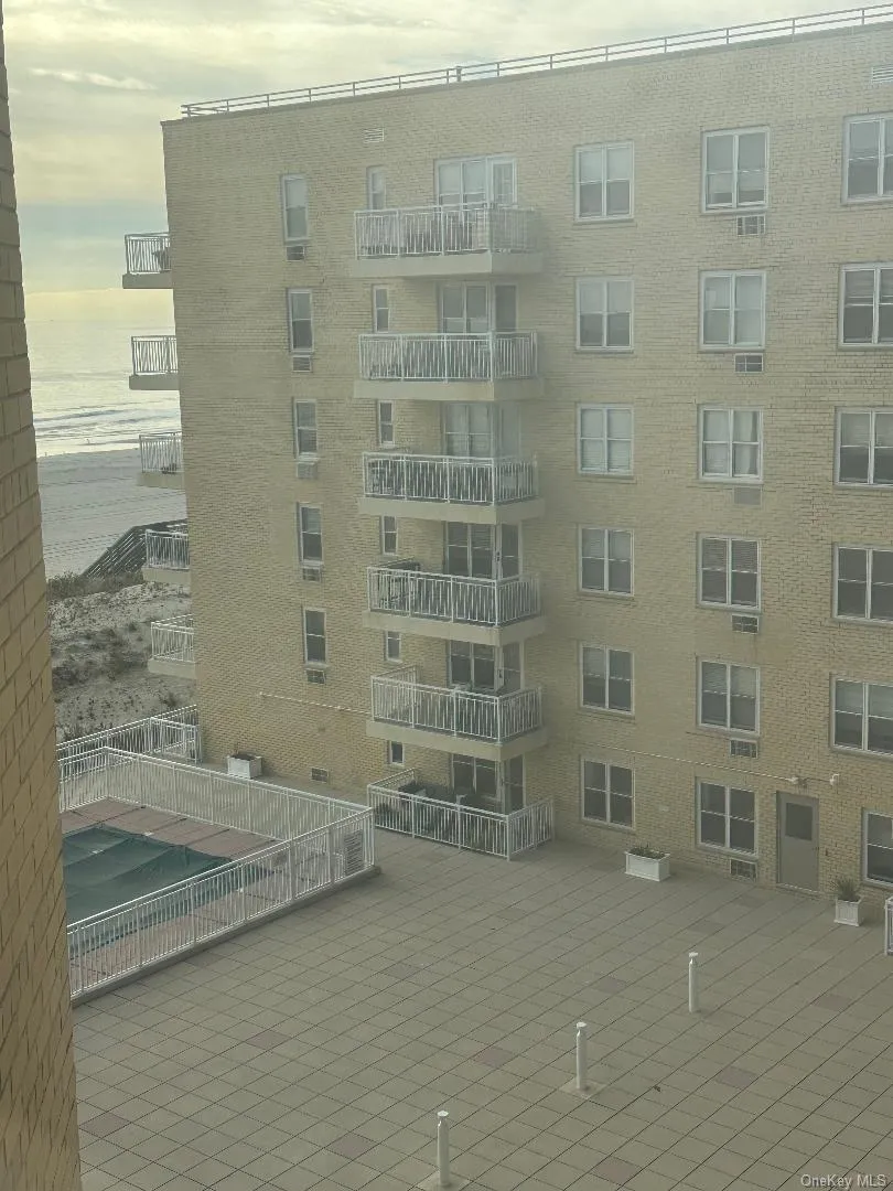 View of apartment building / complex with a water view View of apartment building / complex with a water view