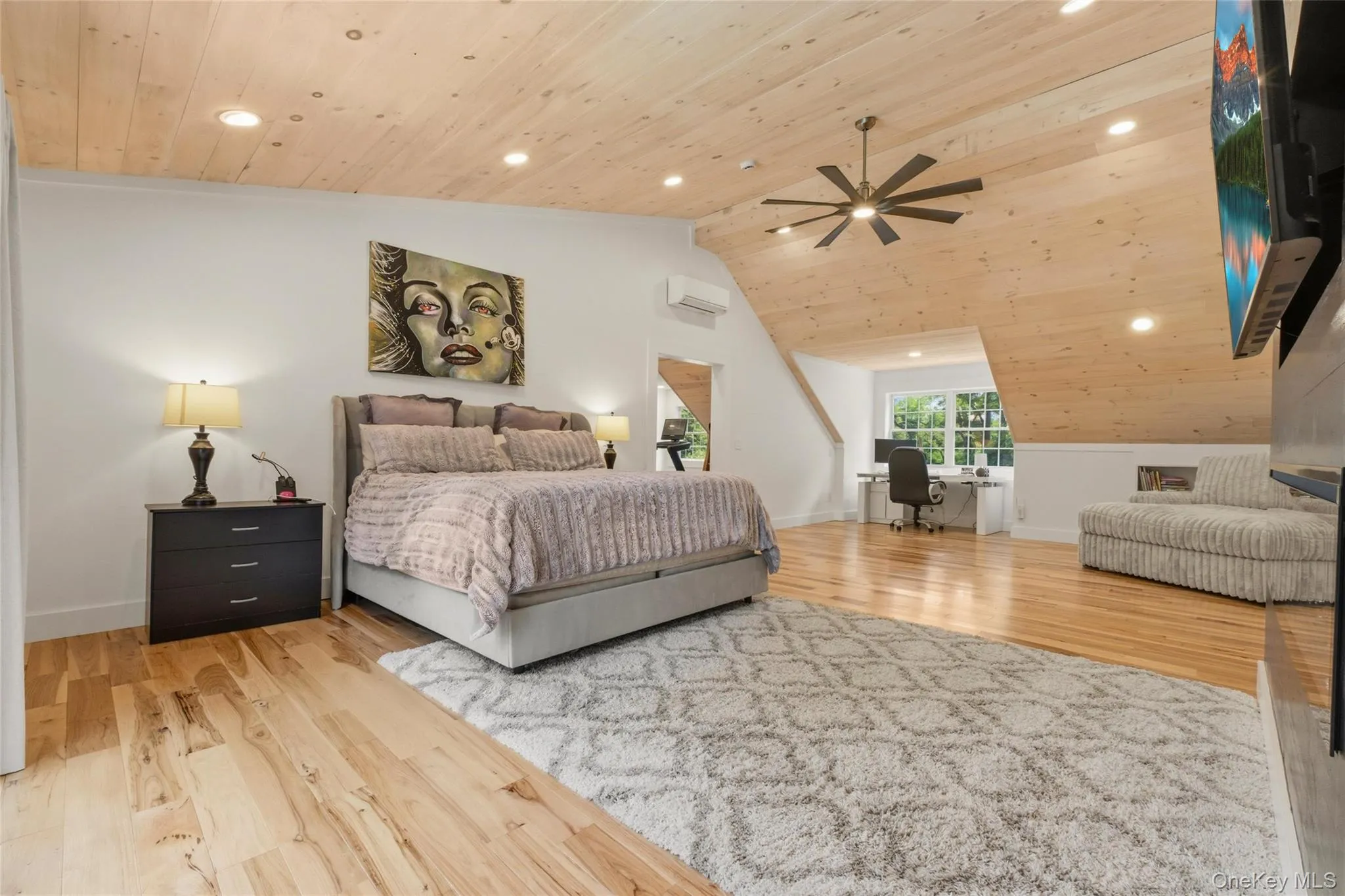 The 2nd primary suite in the home. This spacious bedroom features warm wood finishes, a stylish modern design, and a dedicated workspace filled with natural light. A comfortable and functional retreat. The 2nd primary suite in the home. This spacious bedroom features warm wood finishes, a stylish modern design, and a dedicated workspace filled with natural light. A comfortable and functional retreat.