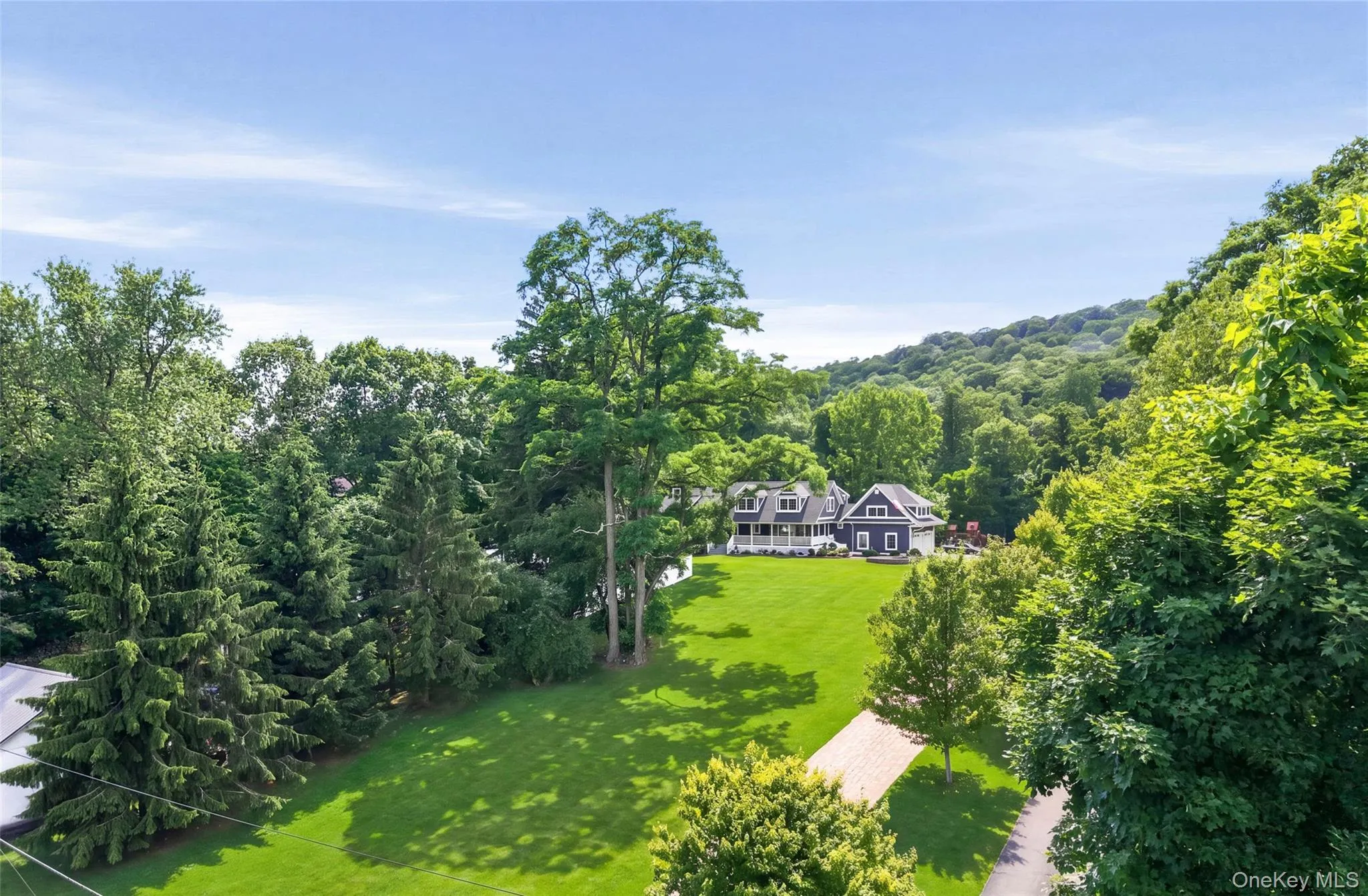 Expansive green lawn surrounds the home with new roof and siding. Expansive green lawn surrounds the home with new roof and siding.