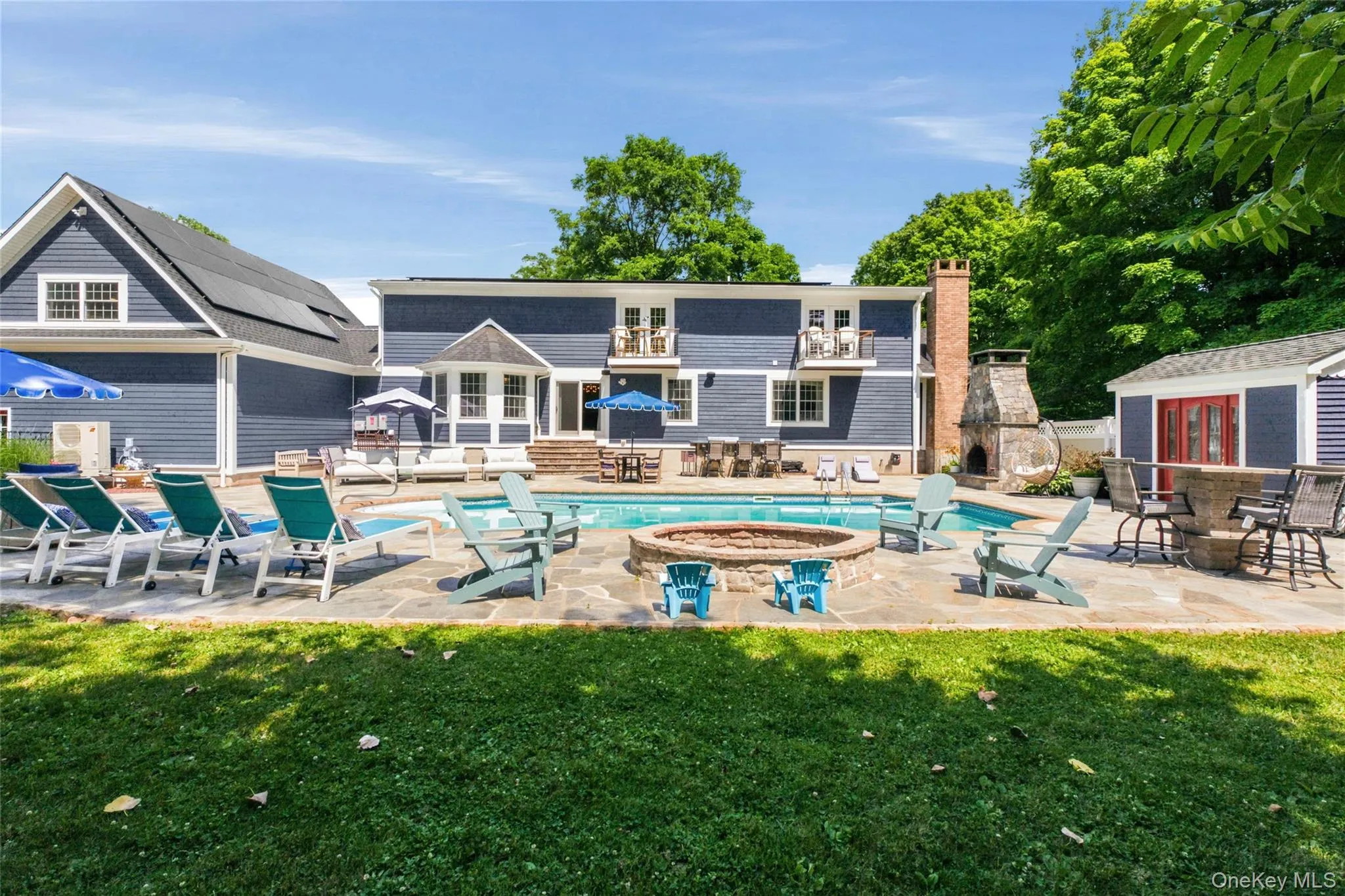 This resort-style backyard includes a pool, fire pit, outdoor bar, and ample lounge seating. With lush landscaping and multiple gathering areas, it’s built for unforgettable entertaining. This resort-style backyard includes a pool, fire pit, outdoor bar, and ample lounge seating. With lush landscaping and multiple gathering areas, it’s built for unforgettable entertaining.