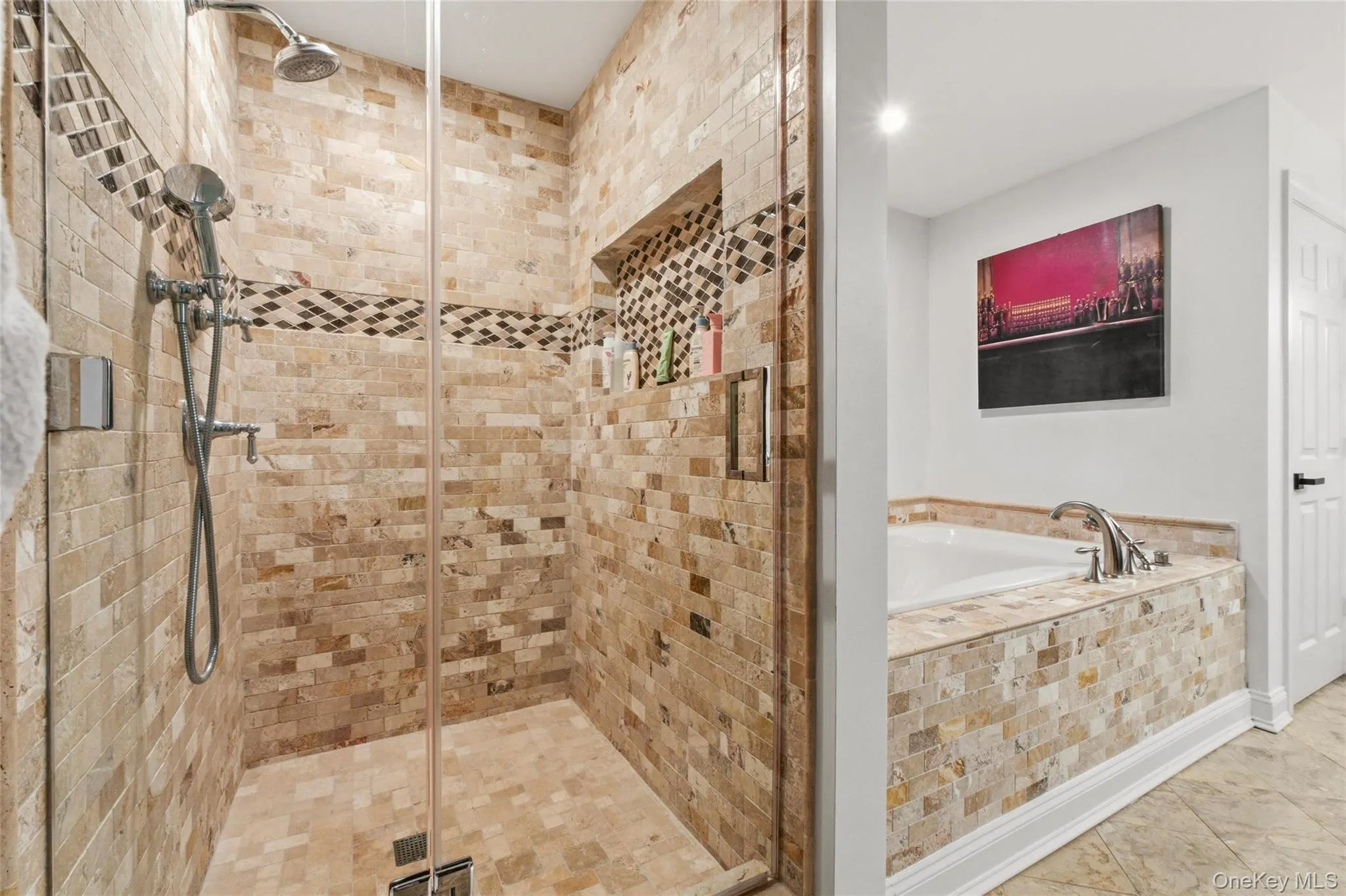 This spa-inspired bathroom showcases a beautifully tiled walk-in shower with dual showerheads and a soaking tub surrounded by stone accents. The warm, neutral palette creates a relaxing, high-end feel. This spa-inspired bathroom showcases a beautifully tiled walk-in shower with dual showerheads and a soaking tub surrounded by stone accents. The warm, neutral palette creates a relaxing, high-end feel.