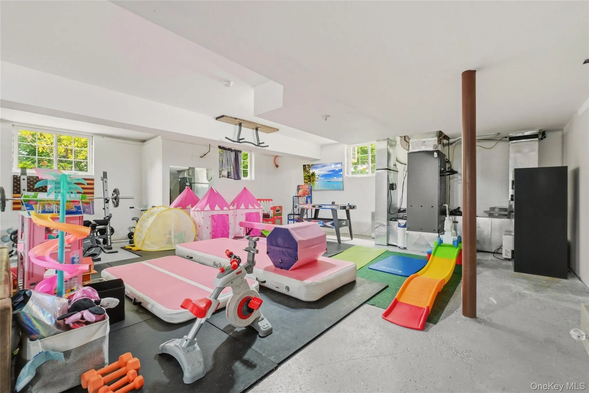 With room for toys, fitness equipment, and recreation, it’s a versatile space for the whole family. With room for toys, fitness equipment, and recreation, it’s a versatile space for the whole family.