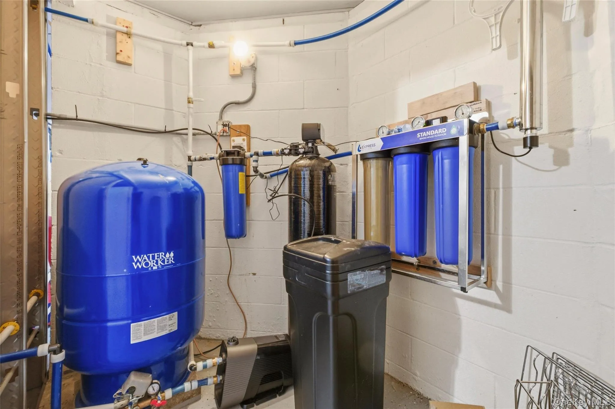 New whole-house water filtration system, including a new Well-Trol tank, whole-home filter units, water softener, and UV purification light. New whole-house water filtration system, including a new Well-Trol tank, whole-home filter units, water softener, and UV purification light.