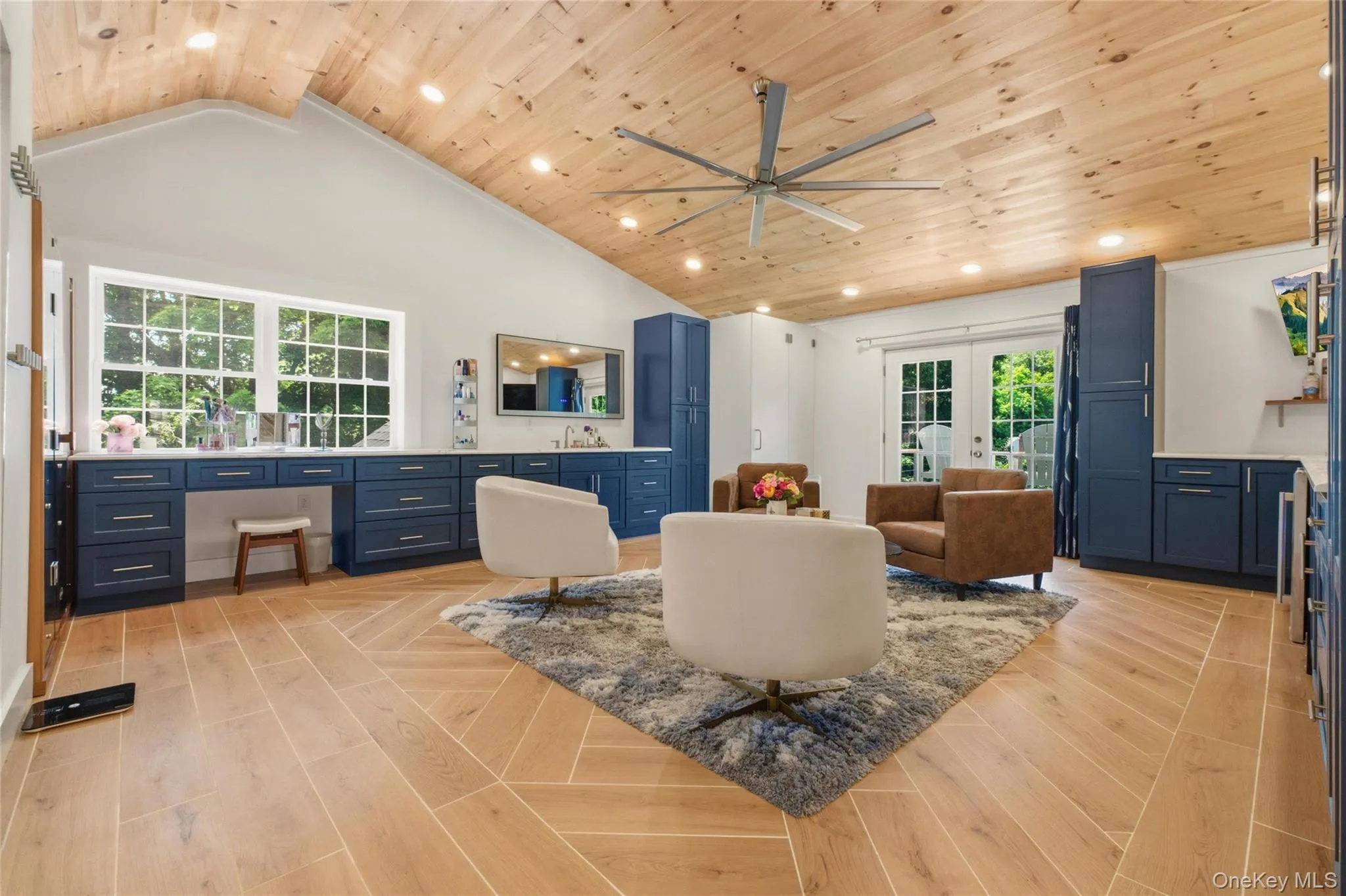 This stunning home spa includes a sauna, steam room, rain shower, and elegant seating area beneath a vaulted wood ceiling. The combination of natural materials and modern finishes creates a true relaxation retreat. This stunning home spa includes a sauna, steam room, rain shower, and elegant seating area beneath a vaulted wood ceiling. The combination of natural materials and modern finishes creates a true relaxation retreat.