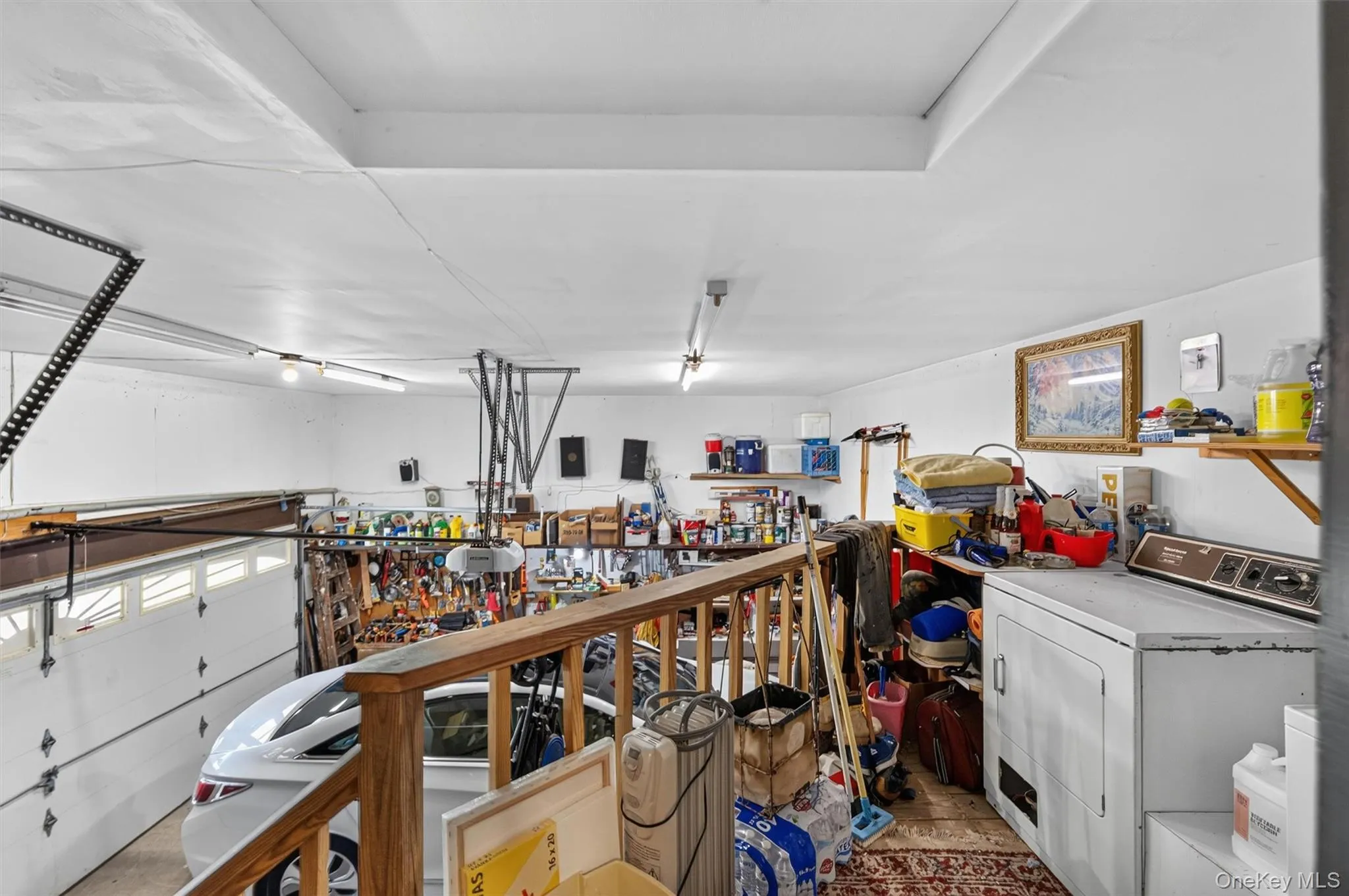 Spacious garage with white walls and a light-colored ceiling Spacious garage with white walls and a light-colored ceiling
