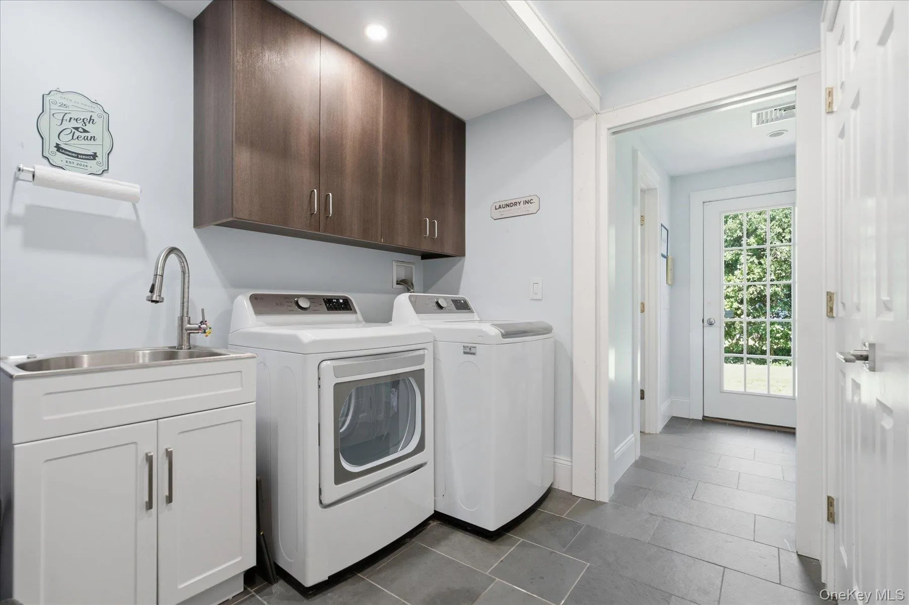Laundry in Mud room off of the living room- Radiant Heat floors Laundry in Mud room off of the living room- Radiant Heat floors