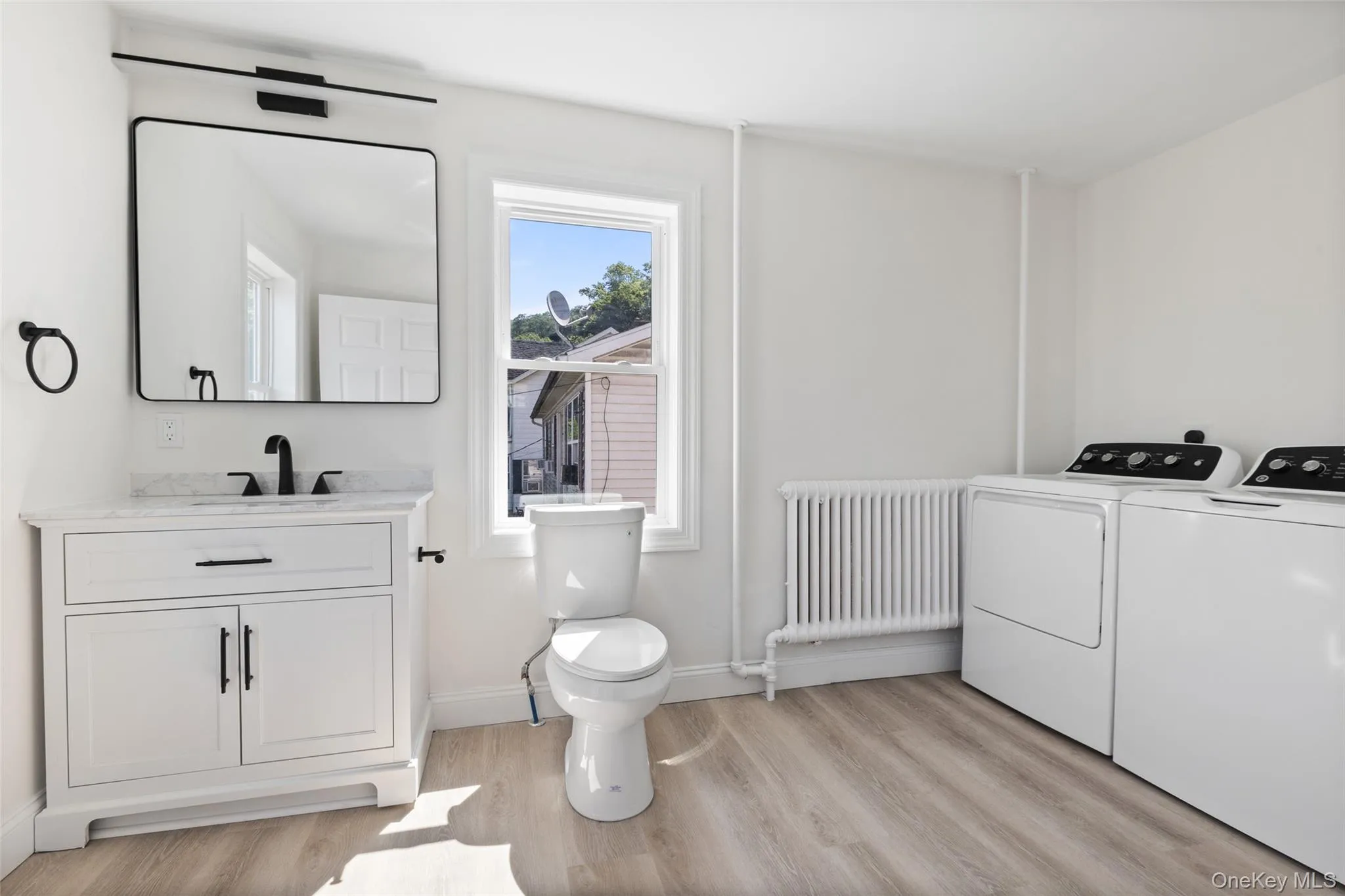 Downstairs half bathroom and laundry Downstairs half bathroom and laundry