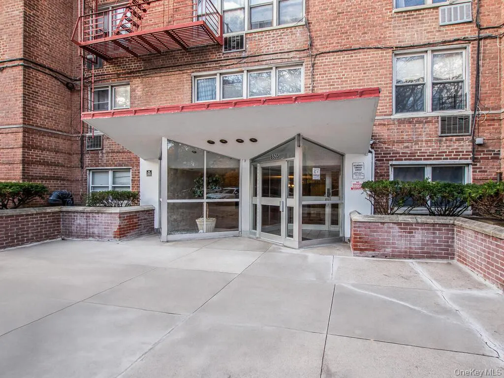 Entrance to property with brick siding and a patio Entrance to property with brick siding and a patio