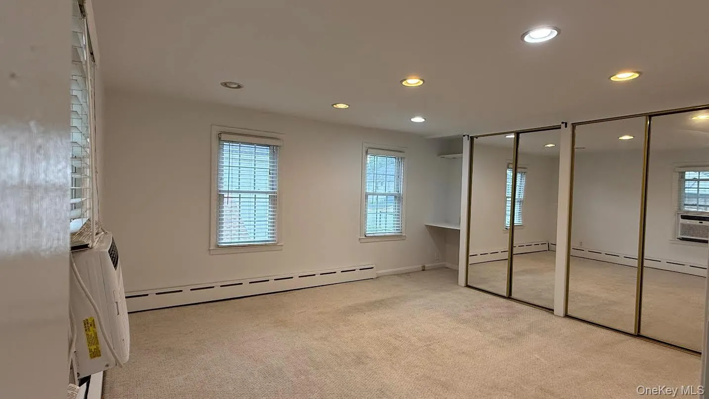 Upper level 2nd bedroom, view of rear yard. Upper level 2nd bedroom, view of rear yard.
