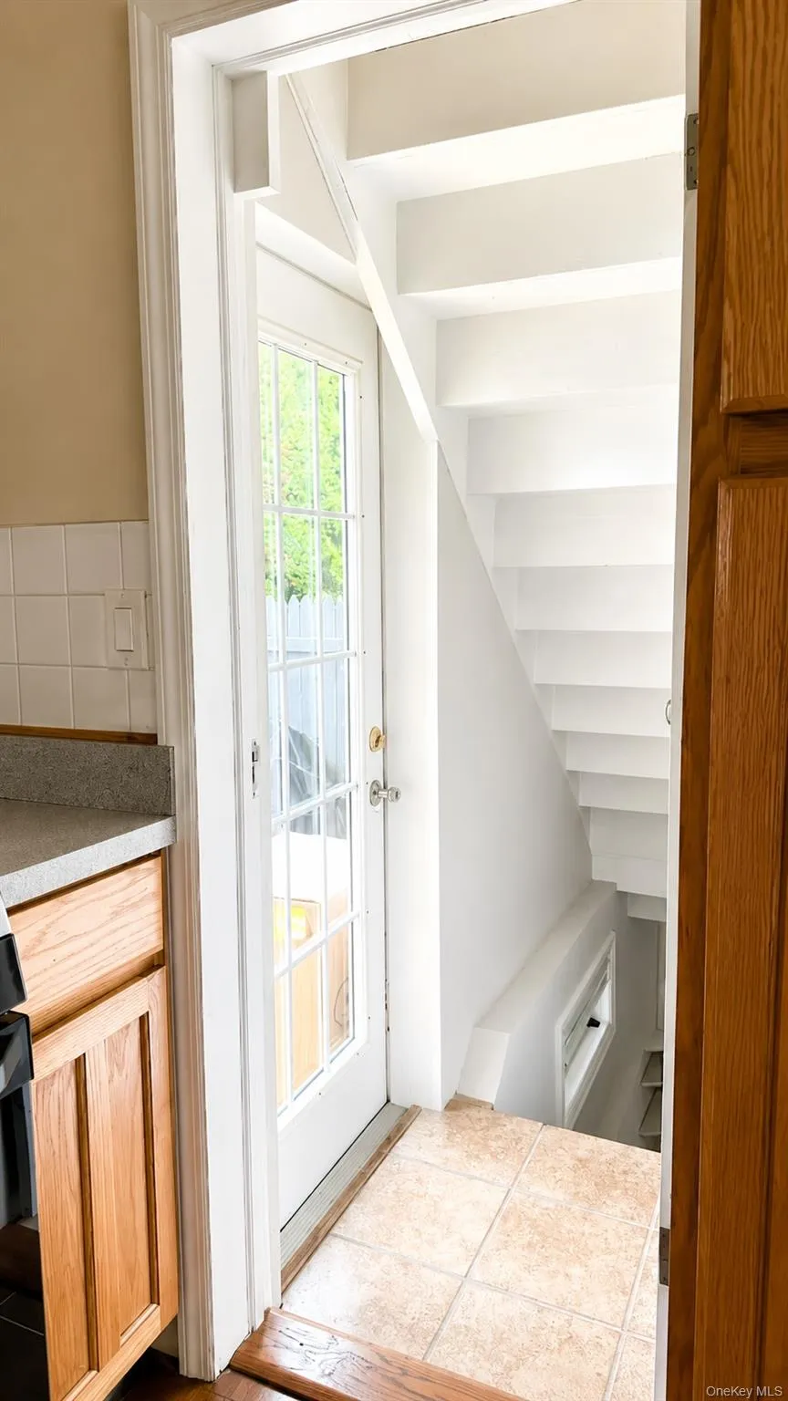 1st Floor stairs - access to side property and finished basement level 1st Floor stairs - access to side property and finished basement level