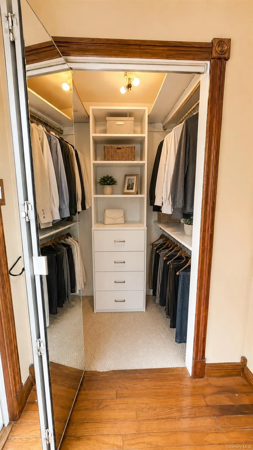 1st floor bedroom walk in closet Virtually staged closet system 1st floor bedroom walk in closet Virtually staged closet system