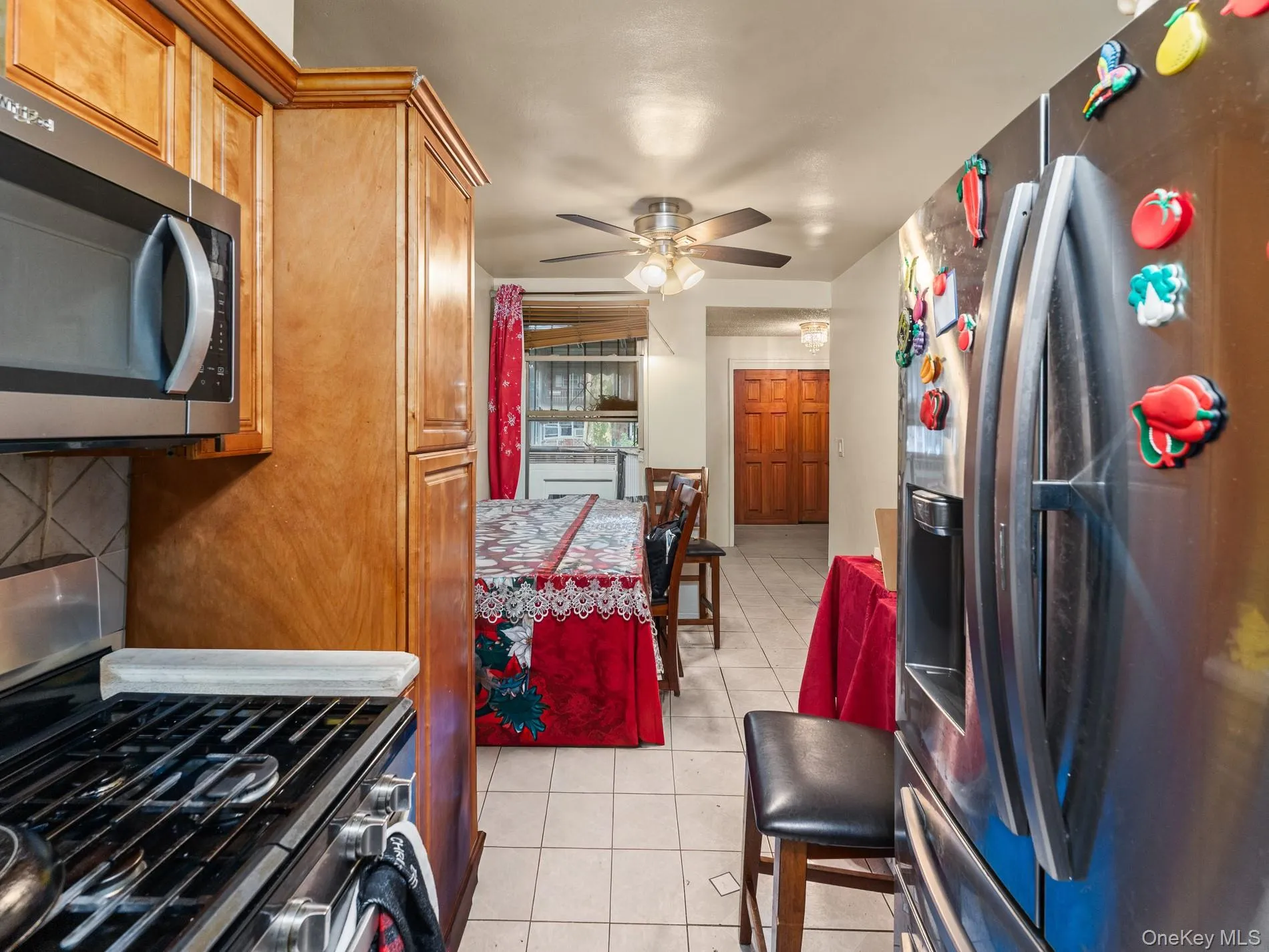 2nd Floor Kitchen featuring wood cabinetry, stainless steel appliances, and ceramic tile flooring 2nd Floor Kitchen featuring wood cabinetry, stainless steel appliances, and ceramic tile flooring