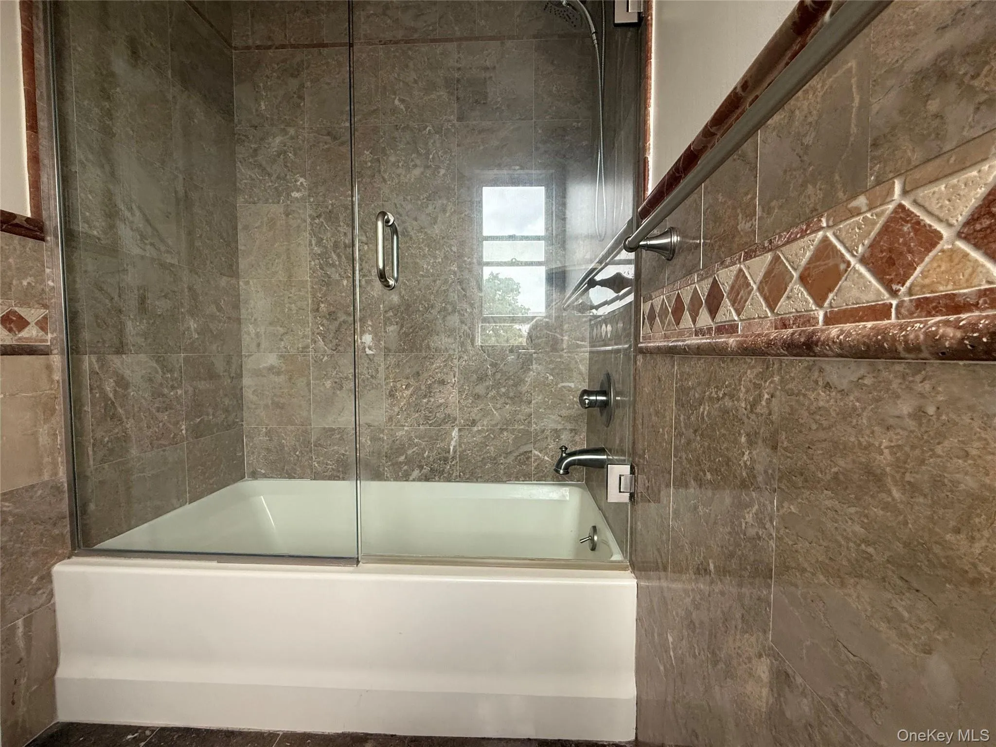 Tub with shower and glass enclosure Tub with shower and glass enclosure