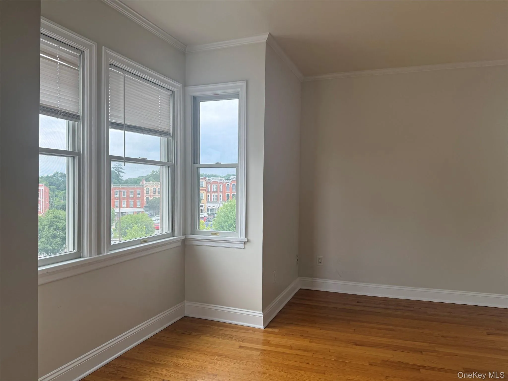 Lovely wood floors and lots of storage and natural light in bedroom Lovely wood floors and lots of storage and natural light in bedroom