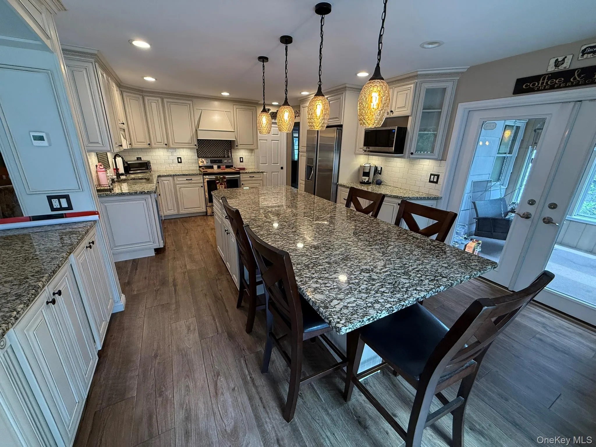 Eat In Kitchen with luxurious Granite tops, tile floor, and stainless steel throughout Eat In Kitchen with luxurious Granite tops, tile floor, and stainless steel throughout