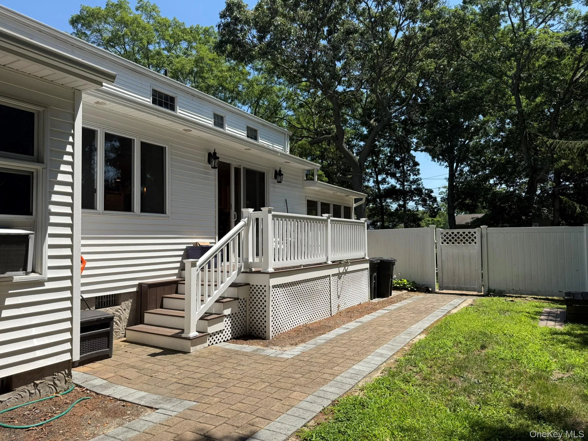 Deck coming off kitchen with walk leading to patio. Deck coming off kitchen with walk leading to patio.