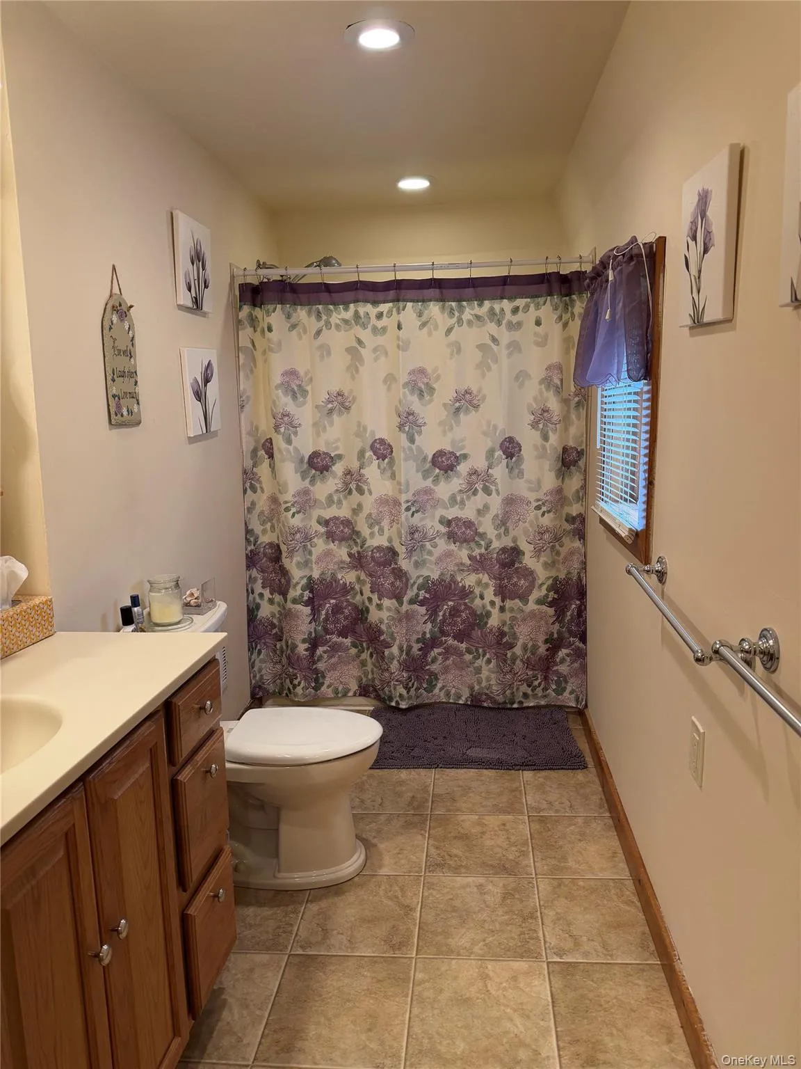 First floor bathroom with custom tile surrounding jetted tub. First floor bathroom with custom tile surrounding jetted tub.