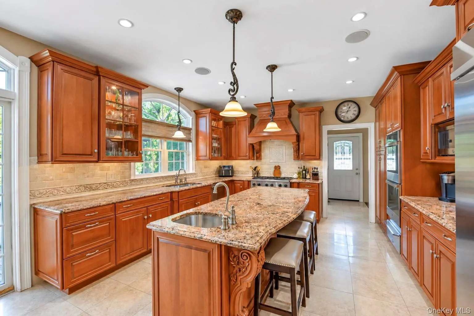 Kitchen featuring wood cabinetry, granite countertops, tile flooring, and recessed lighting Kitchen featuring wood cabinetry, granite countertops, tile flooring, and recessed lighting