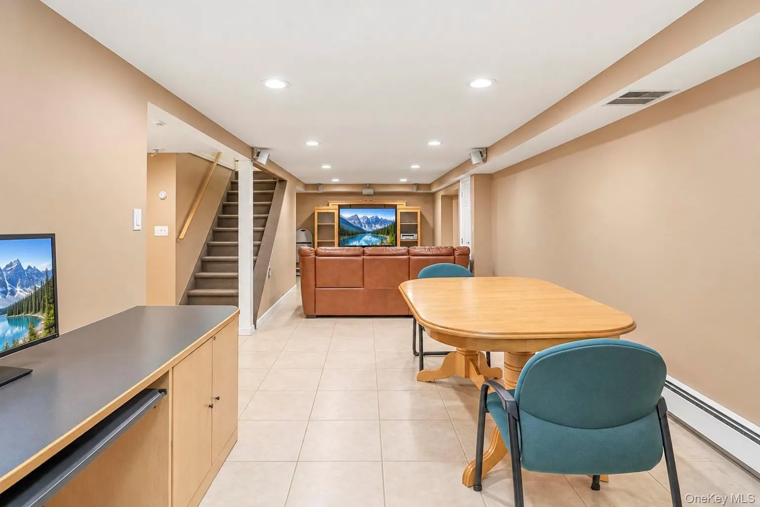 Recessed lighting, light-toned wall finishes, tiled flooring, built-in display shelving, and wood-finish cabinetry Recessed lighting, light-toned wall finishes, tiled flooring, built-in display shelving, and wood-finish cabinetry