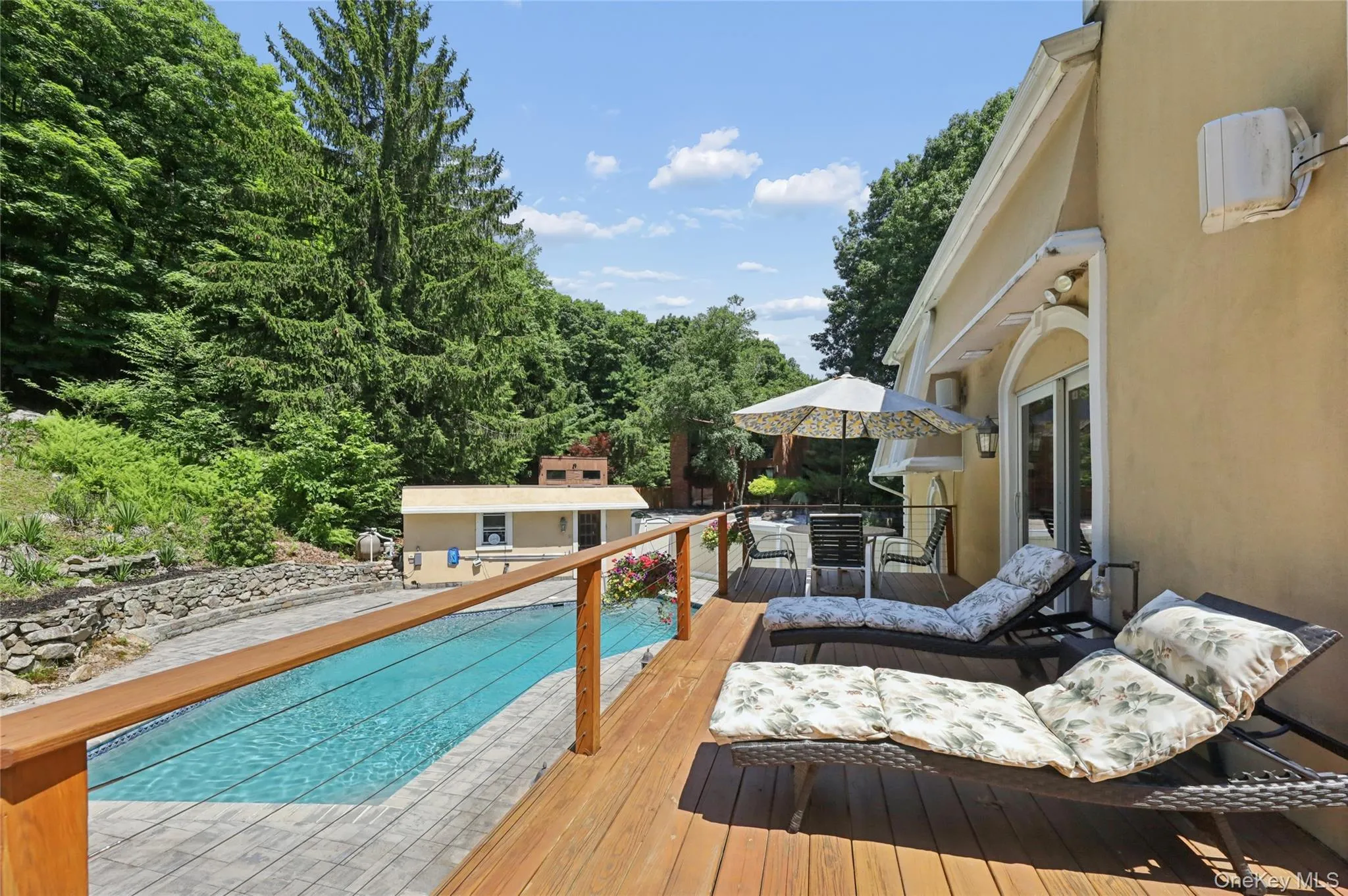 Wrap around deck with coffee table and lounges Wrap around deck with coffee table and lounges