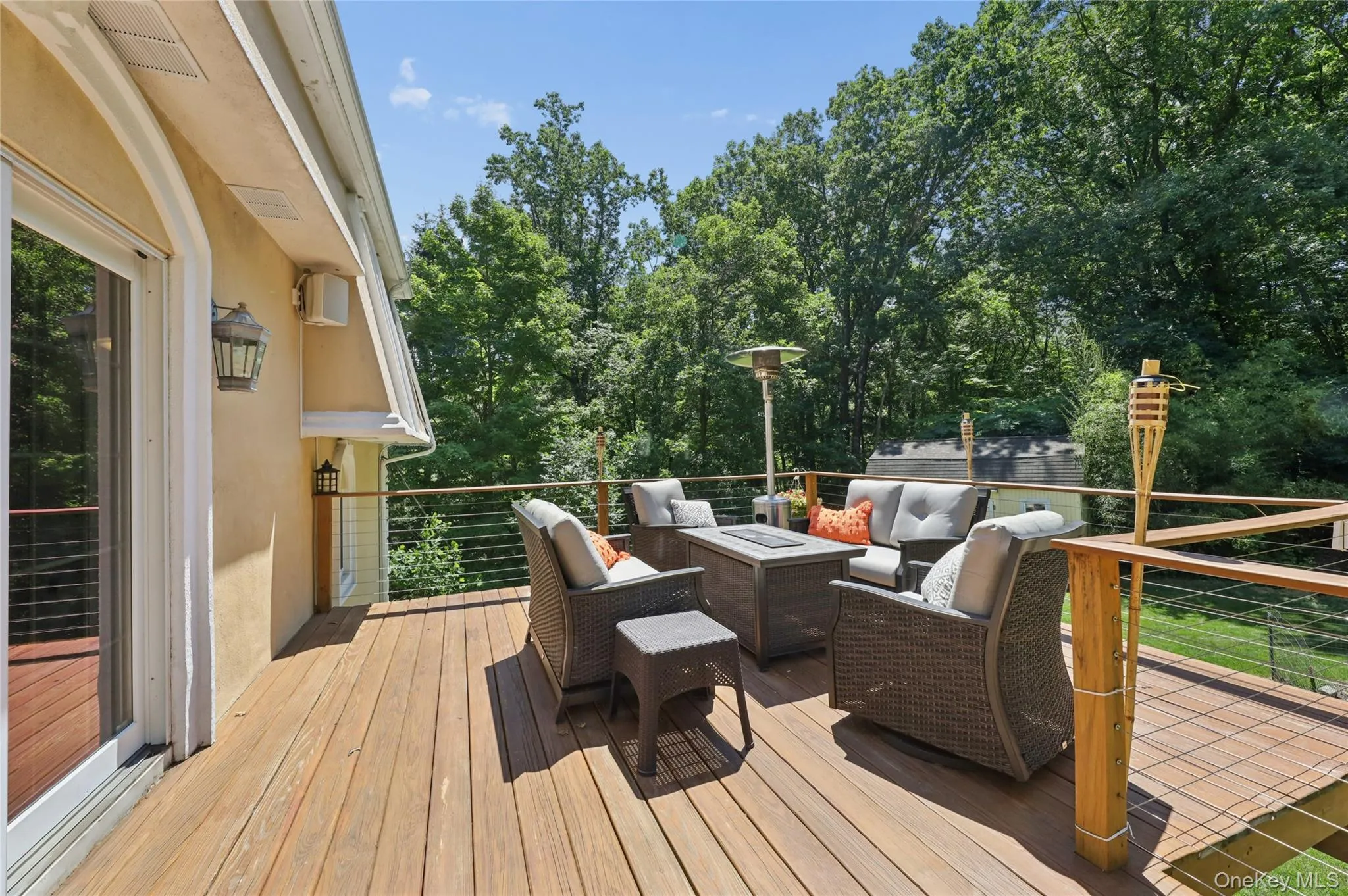 Wrap around deck with outdoor seating area. Wrap around deck with outdoor seating area.