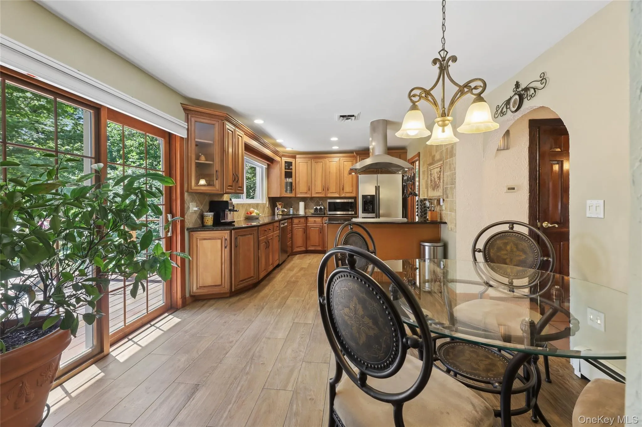 Eat-in kitchen with glass slighting door to off kitchen balcony. Eat-in kitchen with glass slighting door to off kitchen balcony.