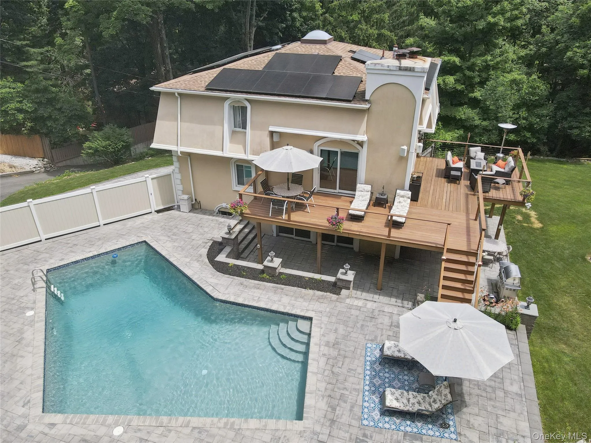 side of the house with pool patio, pool, wrap around deck. side of the house with pool patio, pool, wrap around deck.