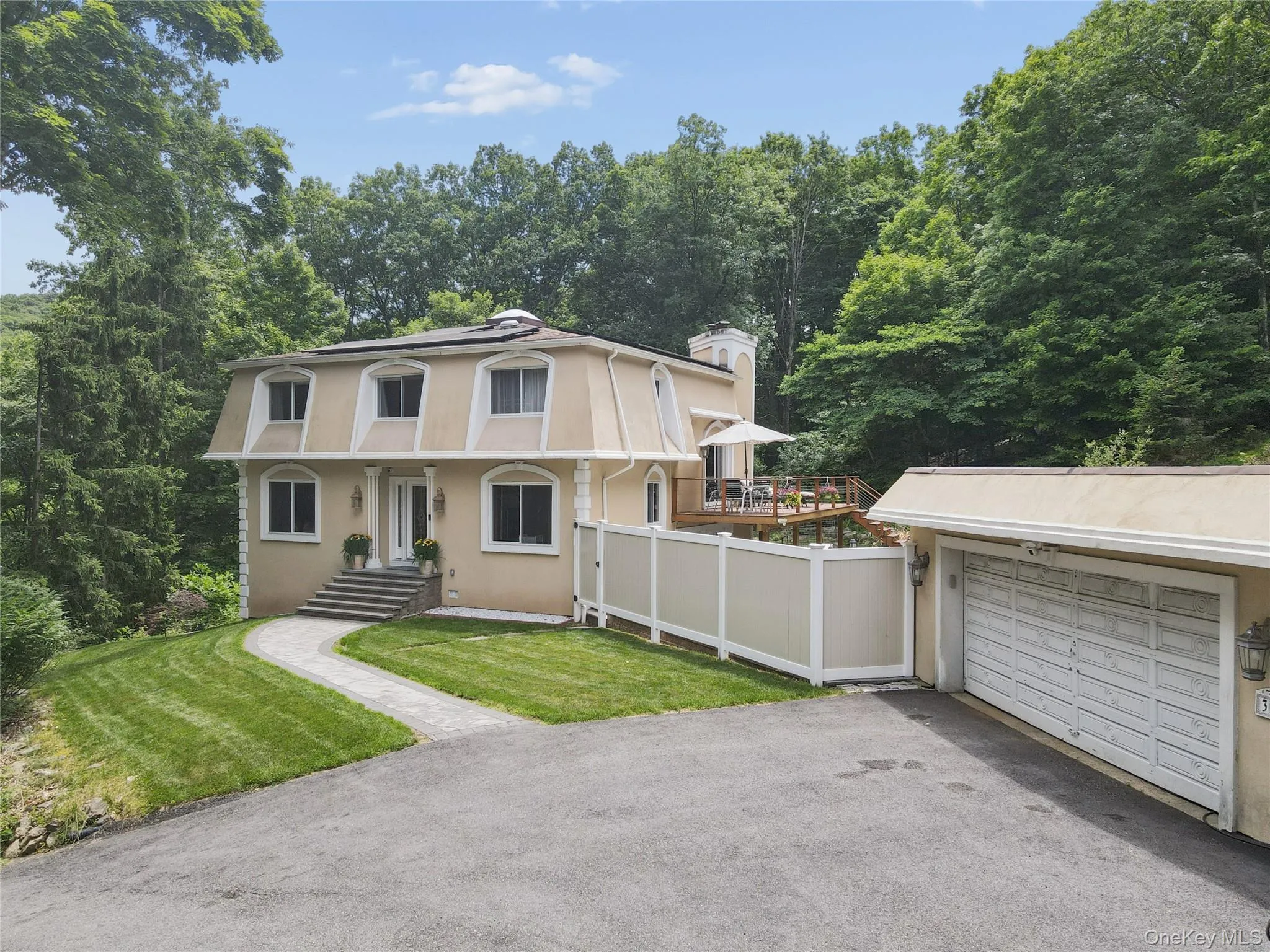 Main entrance with detached 2 car garage and carport. Main entrance with detached 2 car garage and carport.
