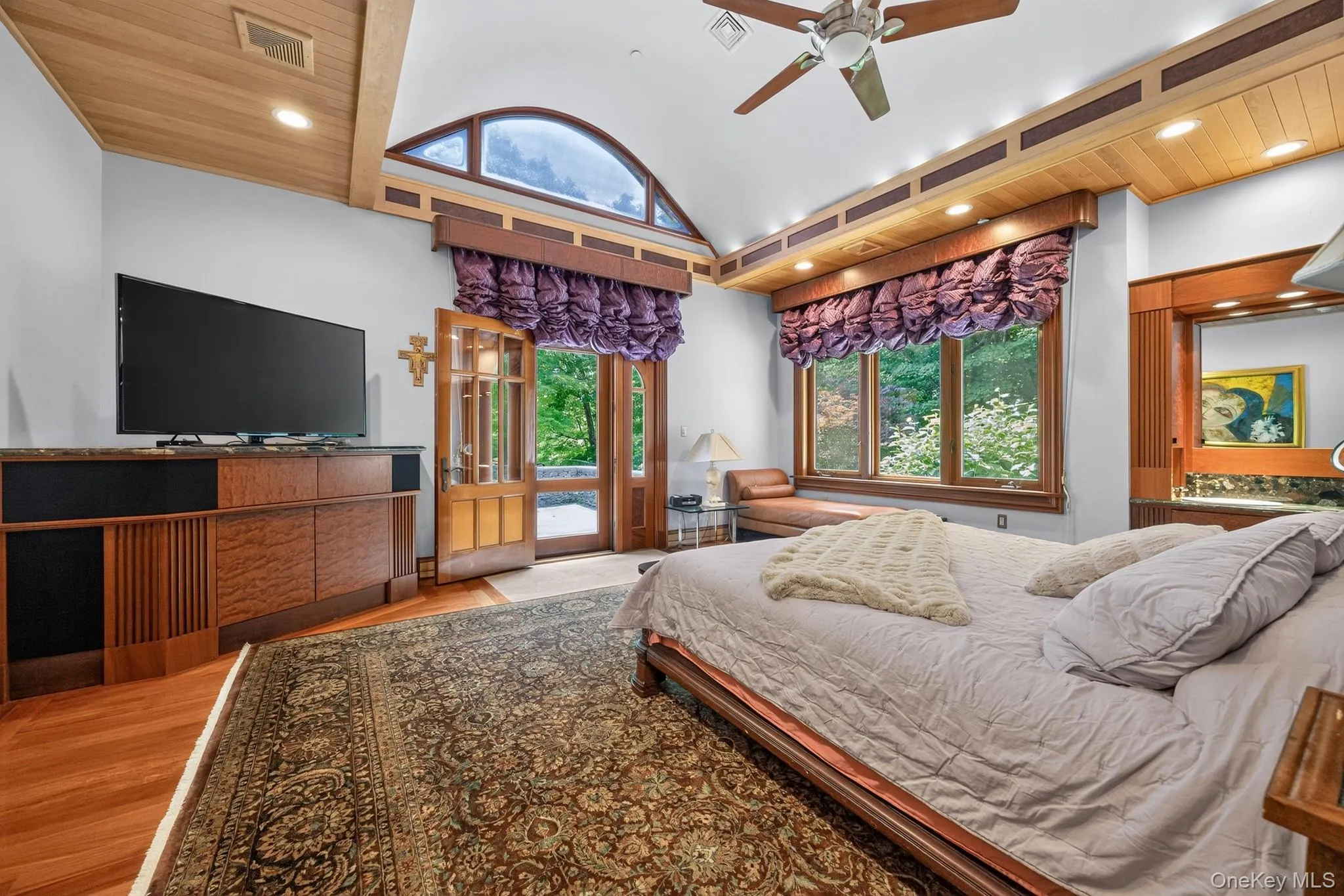 Vaulted ceiling with wood paneling and recessed lighting Vaulted ceiling with wood paneling and recessed lighting
