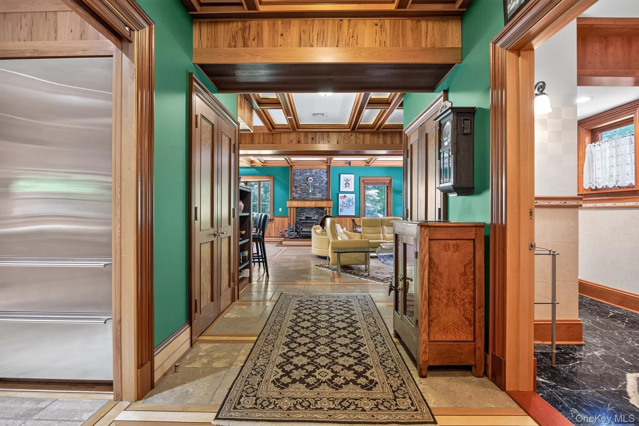 Interior hallway with wood-finish trim and architectural ceiling details Interior hallway with wood-finish trim and architectural ceiling details