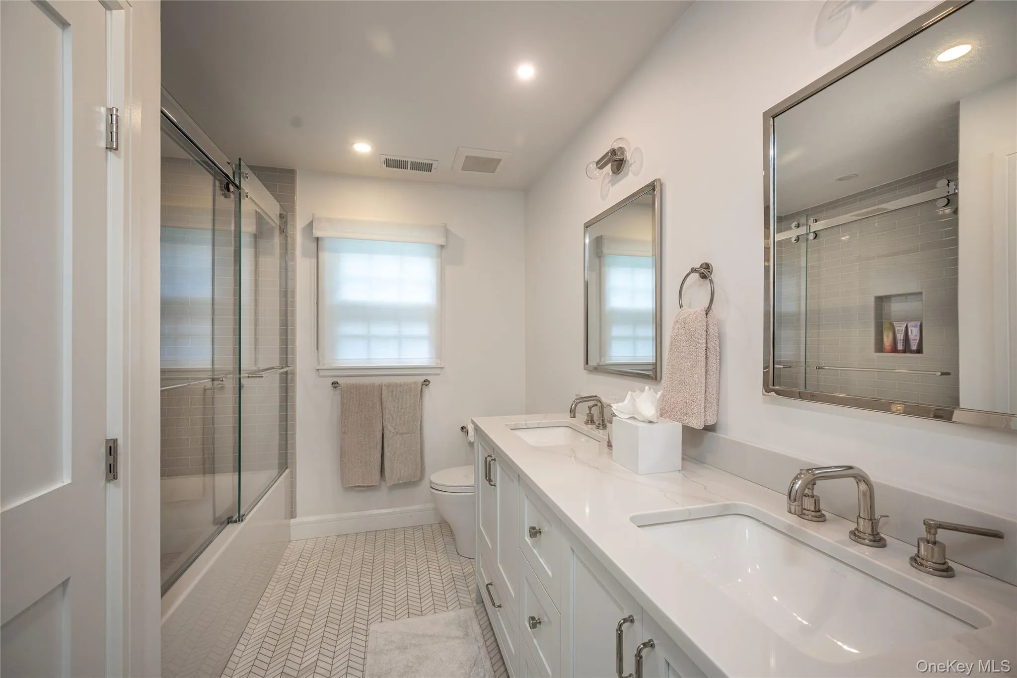 Beautifully Appointed Full Hall Bath with Double Vanity Beautifully Appointed Full Hall Bath with Double Vanity