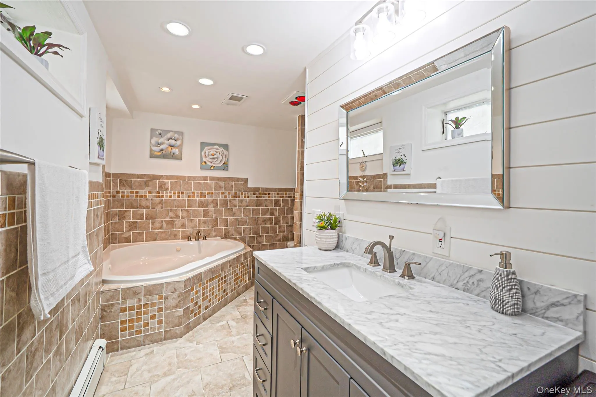 Full bath with single sink vanity, stall shower and platform tub Full bath with single sink vanity, stall shower and platform tub