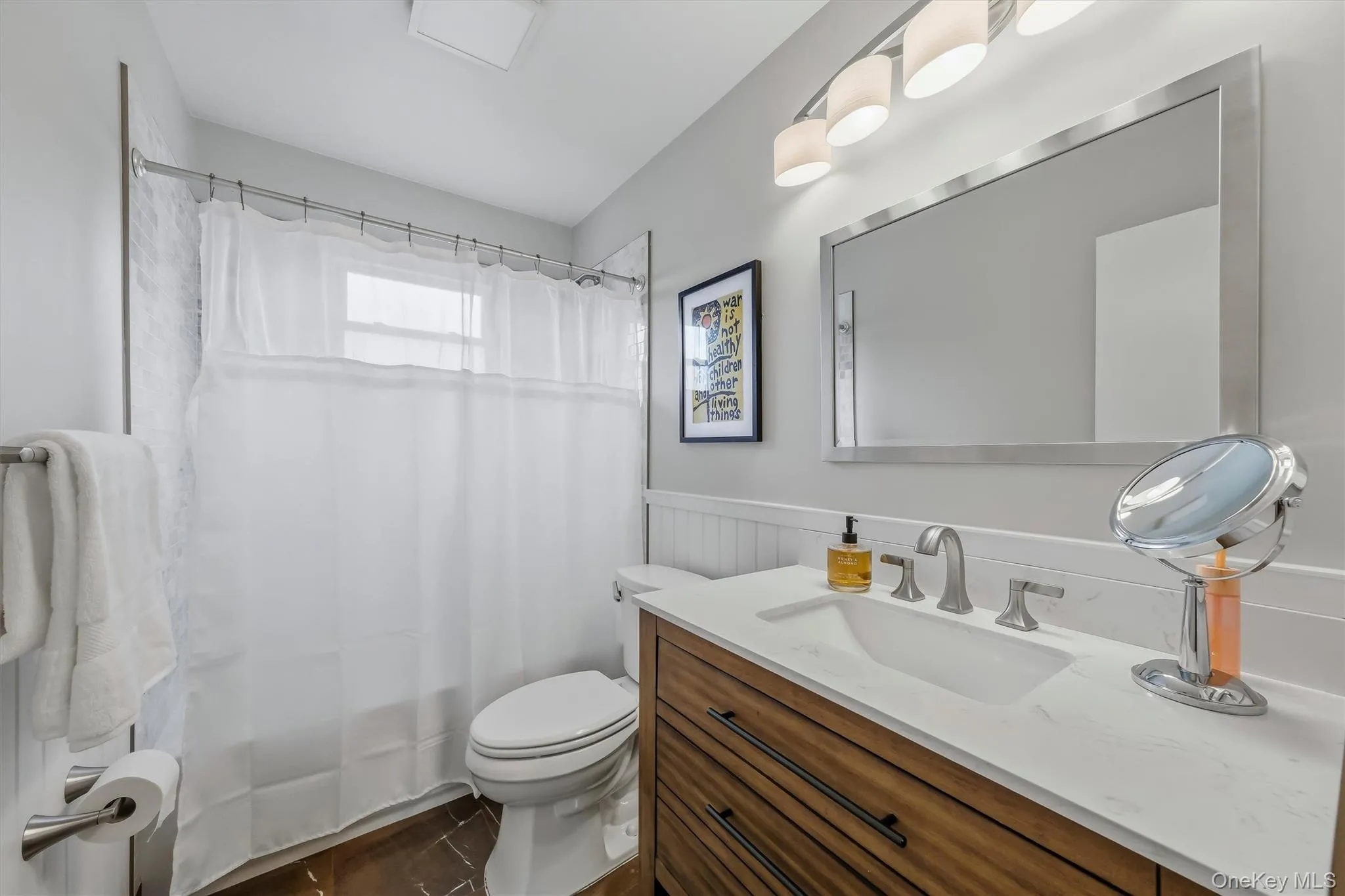 Updated bathroom with attractive finishes. Updated bathroom with attractive finishes.