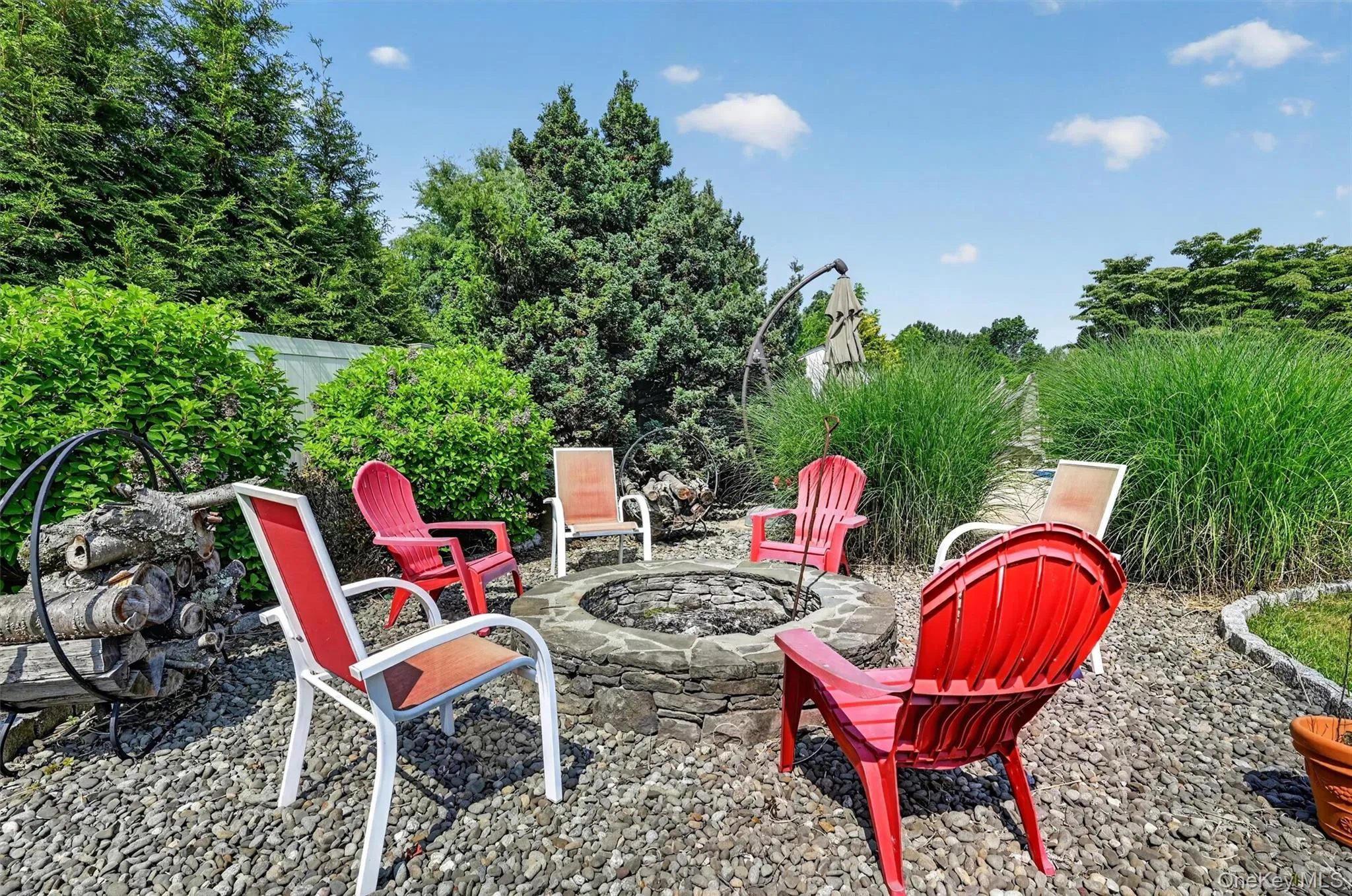 A dedicated firepit area adds another inviting spot to gather, unwind, and enjoy evenings outside. A dedicated firepit area adds another inviting spot to gather, unwind, and enjoy evenings outside.