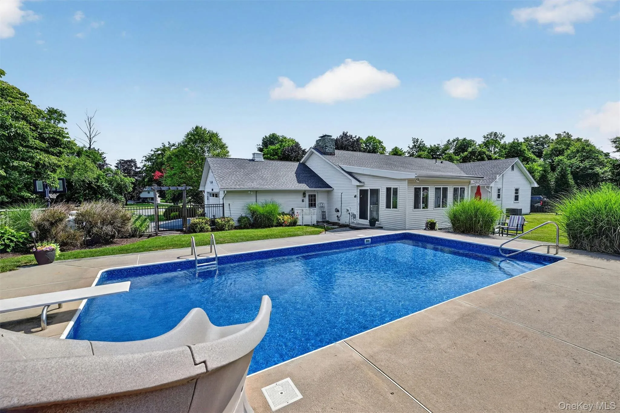 The inground pool creates a standout centerpiece for summer living. The inground pool creates a standout centerpiece for summer living.