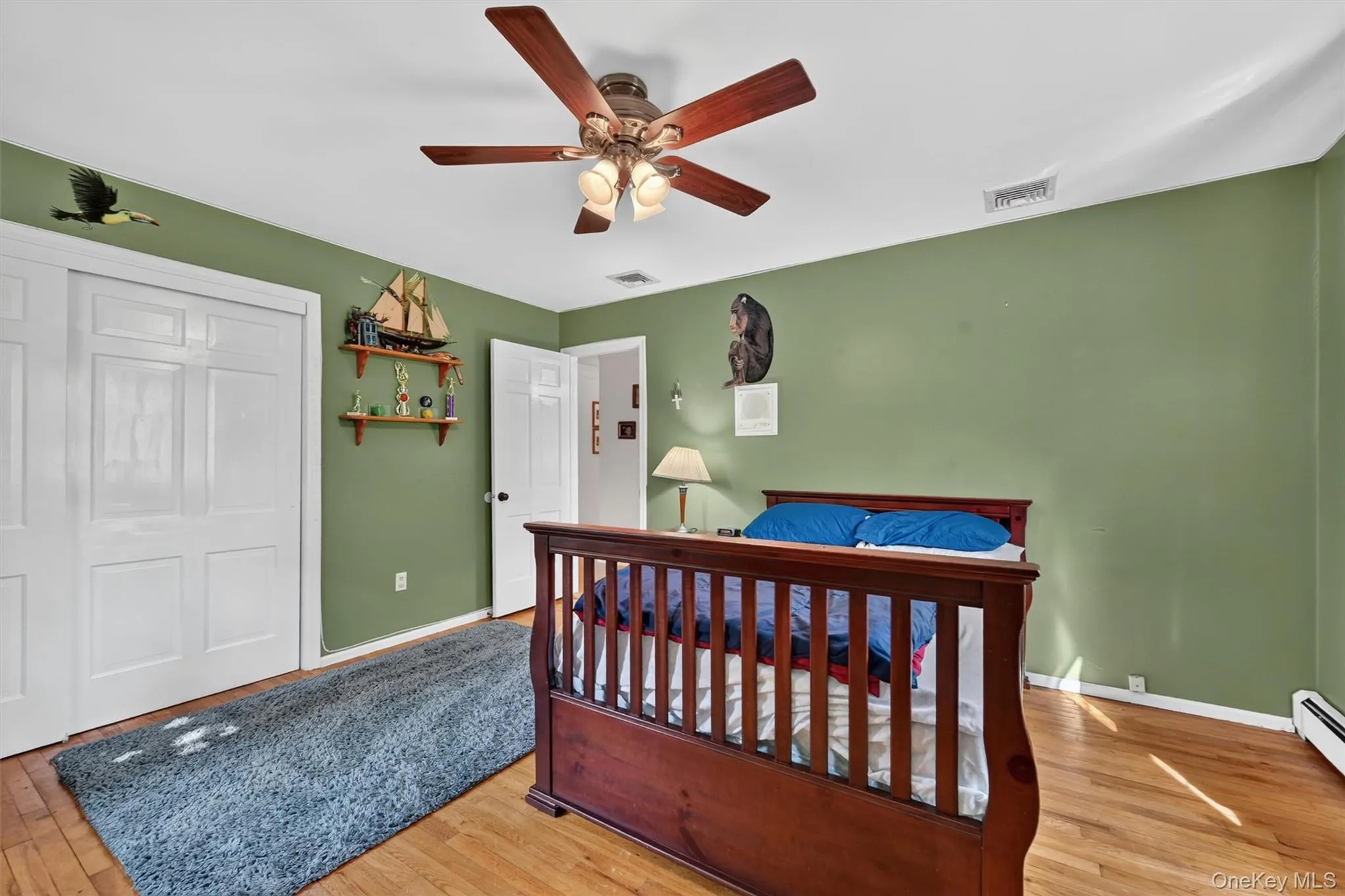 With hardwood floors, natural light, and closet space, this bedroom adds to the home’s practical and flexible ranch layout. With hardwood floors, natural light, and closet space, this bedroom adds to the home’s practical and flexible ranch layout.